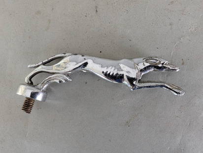 Ford Lincoln Greyhound Hood Ornament by Gorham Manufacturing Company: Ford Lincoln Greyhound hood ornament, measuring 5 1/2 inches wide x 2 high x 2 deep, made of chrome-plated metal. Produced by the Gorham Manufacturing Company, a renowned silversmithing firm, this pie