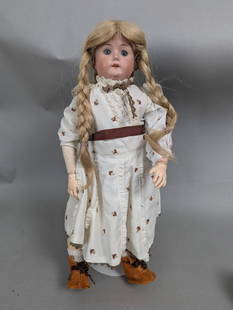 William Goebel Porcelain Doll with Braided Hair and Dress: William Goebel porcelain doll measuring 18 inches in height, 9 inches in width, and 3 inches in depth. The doll features a well-crafted, hand-painted bisque porcelain face with blue glass eyes, rosy c