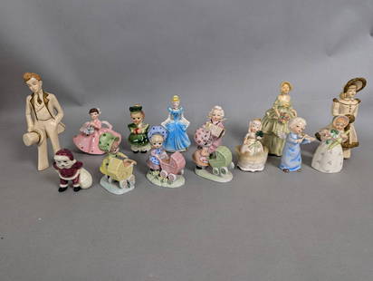 Lot of Ceramic Figurines Featuring People and Animals: Ceramic figurines comprising 14 pieces in total. The largest figurine measures approximately 8 inches in height, 4 inches in width, and 4 inches in depth. All pieces depict various figures, including