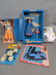 Dolls and Accessories Including Mary Poppins and Ginny: A Horsman Mary Poppins doll in box measuring approximately 19 high x 12 wide x 4 deep inches, a Ginny Vogue doll with roller skates and accessories in original packaging, and a vintage doll from a box