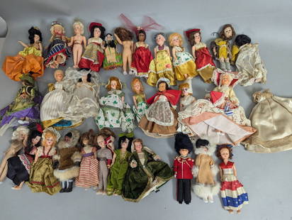 1960s Character Dolls with Clothing and Accessories Large Lot: Character dolls dating to the 1960s, one measuring approximately 9 high x 3 wide x 2 deep in inches. This collection includes over 25 dressed dolls, each featuring period clothing, hairstyles, and var