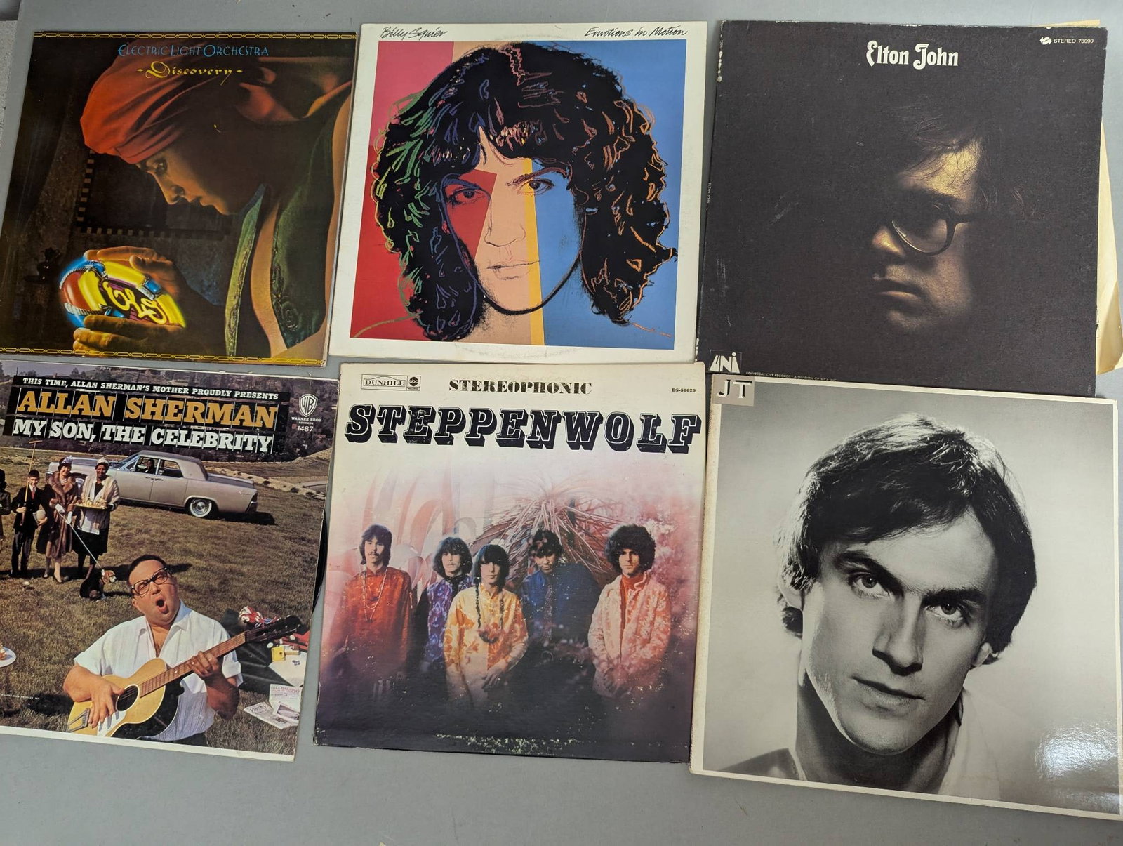 Vinyl Records Featuring Various Artists and Genres Lot of 24: Vinyl records featuring various artists and albums. Includes titles such as Steppenwolf by Steppenwolf, My Son the Celebrity by Allan Sherman, Blue Moves by Elton John, Sweet Baby James by James Taylo