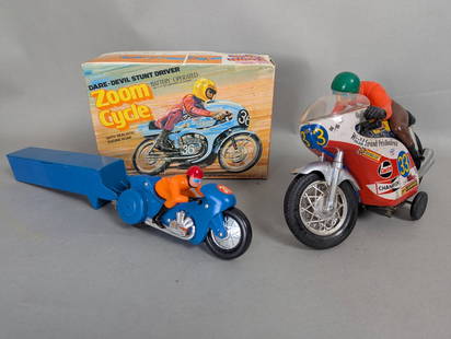 Two Motorcycle Toys Including 1964 Tin Litho Sears Toy Box Rider and Zoom Cycle: Two collectible motorcycle toys comprising a vintage 1964 Sears Toy Box Rider Speed Bike and a Zoom Cycle featuring a dare-devil stunt driver. The Sears Toy Box Rider Speed Bike, made of tin litho, me