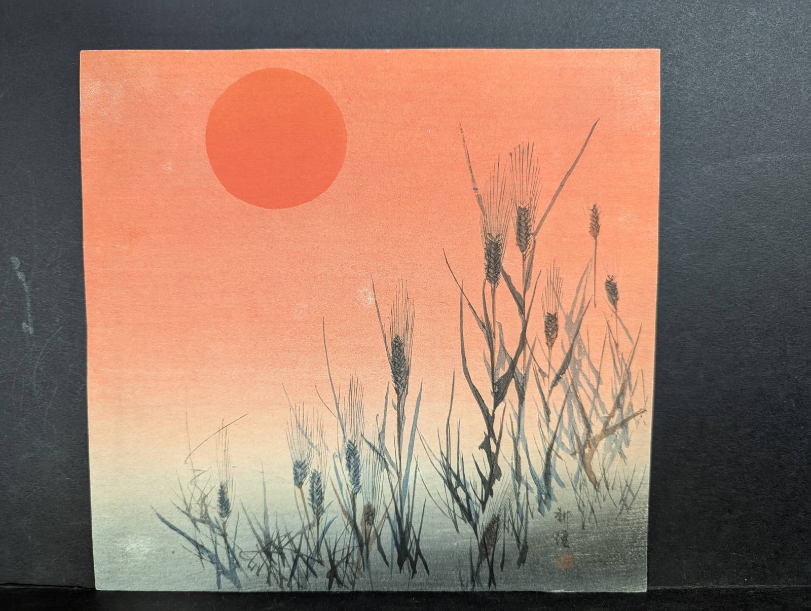 Japanese Woodblock Print by Tsukioka Kogyo Depicting Sunset: Japanese woodblock print depicting a serene sunset with silhouetted plants by Tsukioka Kogyo (1869-1927). Kogyo was a prominent Japanese artist best known for his innovative depictions of noh theater 