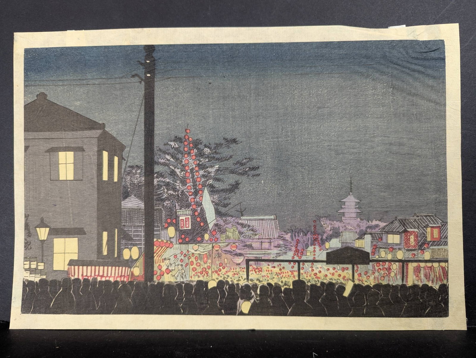 Japanese Woodblock Print by Kobayashi Kiyochika Depicting Year-End Market: Japanese woodblock print created by artist Kobayashi Kiyochika in 1881, depicting the Year-End Market at Sensoji Temple (Hagoita-Ichi Fair) in Asakusa, Tokyo, Japan. The image captures the nocturnal s