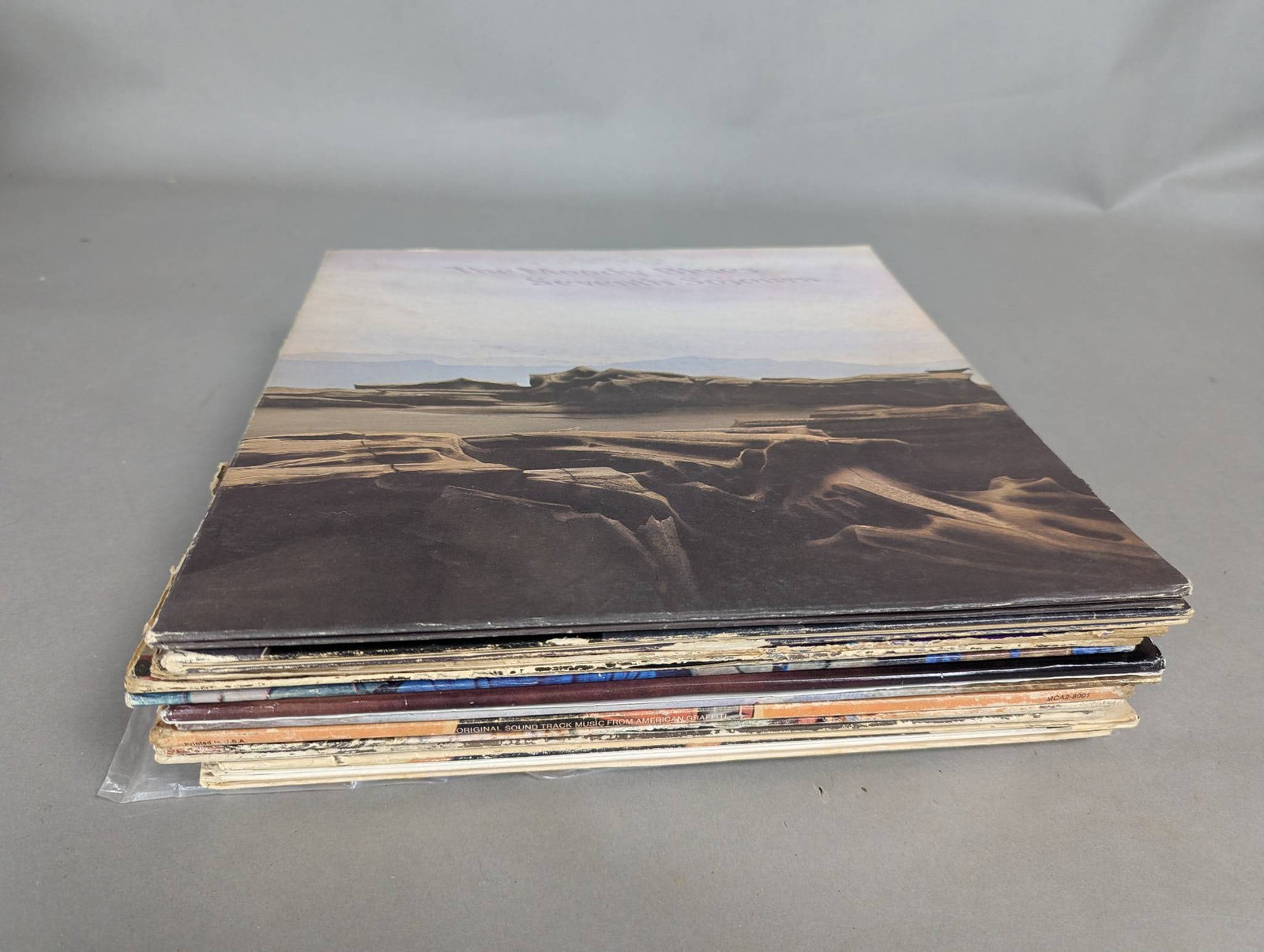 16 Rock Vinyl Records from 1960s and 1970s Featuring Elvis and Cream: 16 rock vinyl records from the 1960s and 1970s, all in well-maintained condition and from the same estate. This collection includes titles from iconic bands and artists such as Elvis Presley, Cream, T