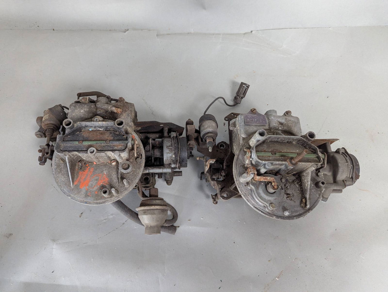 Motorcraft 2100 and 2150 Carburetors for Ford and Jeep Engines: Two Motorcraft 2-barrel carburetors, likely models 2100 and 2150, commonly used in Ford and Jeep engines. These carburetors are seen in various Ford vehicles from the late 1950s through the 1980s, and
