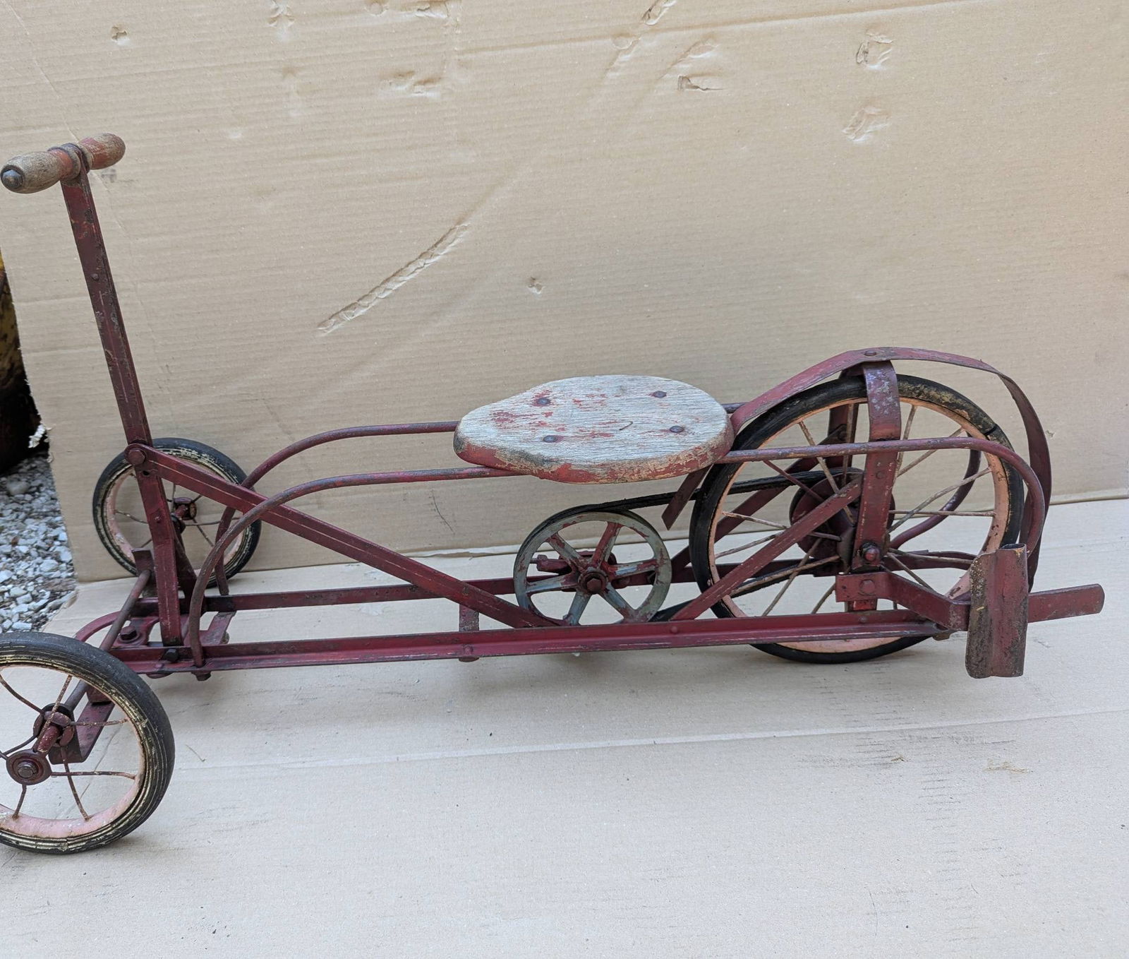 Doodlebug Spe-Da-Way Vintage Push-Pull Ride-On Toy Early 1900s: A Doodlebug Spe-Da-Way Push Cart from the early 1900s, a vintage child's ride-on push-pull toy constructed from pressed steel and cast iron. Measuring approximately 37 inches high by 18 inches wide by