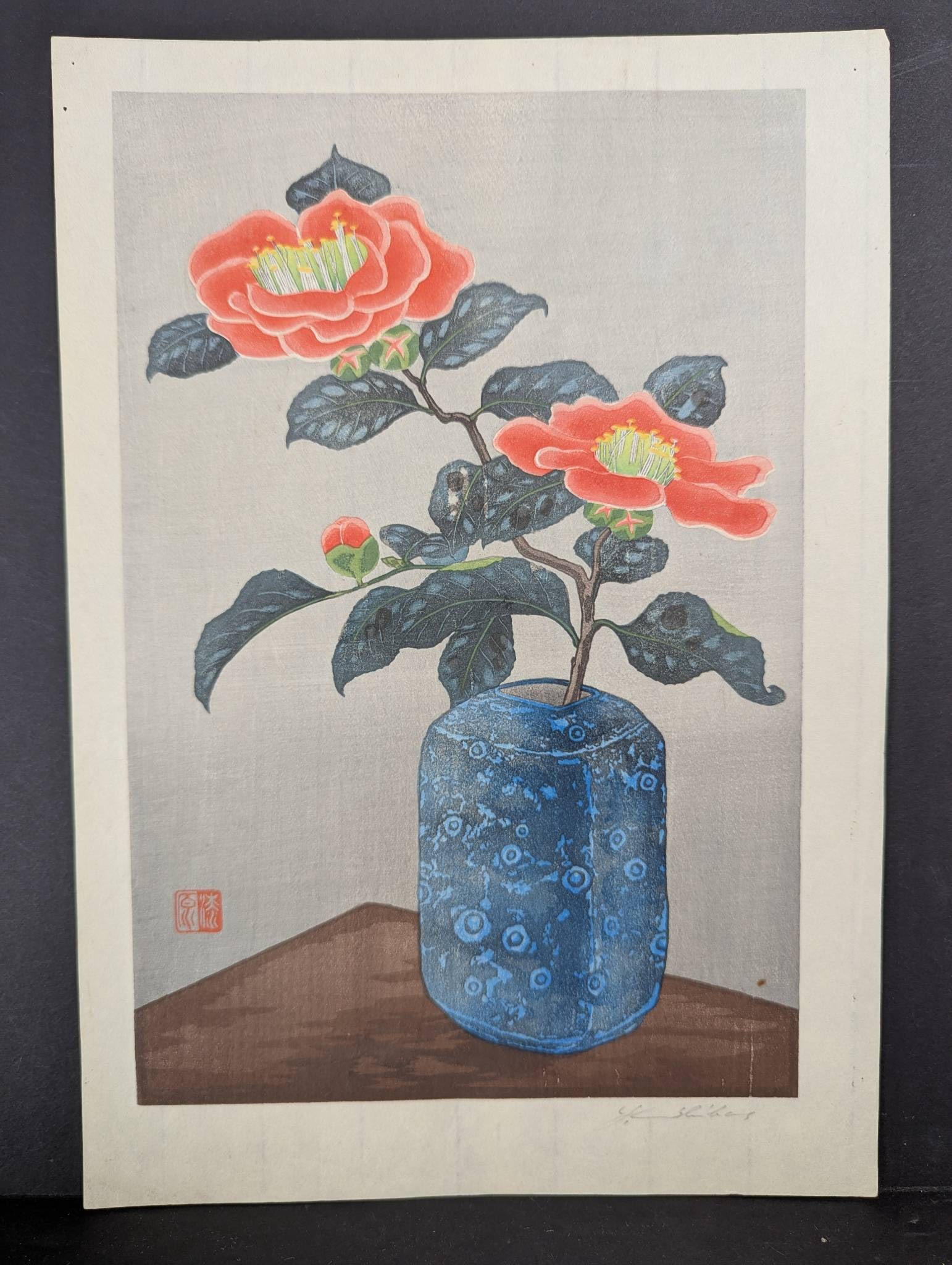 Camellias in a Vase by Yoshijiro Urushibara Japanese Woodblock Print: Woodblock print titled Camellias in a Vase by the Japanese artist Yoshijiro Urushibara (1888-1953), also known as Urushibara Mokuchu. This artwork exemplifies the kacho-e style, combining traditional 