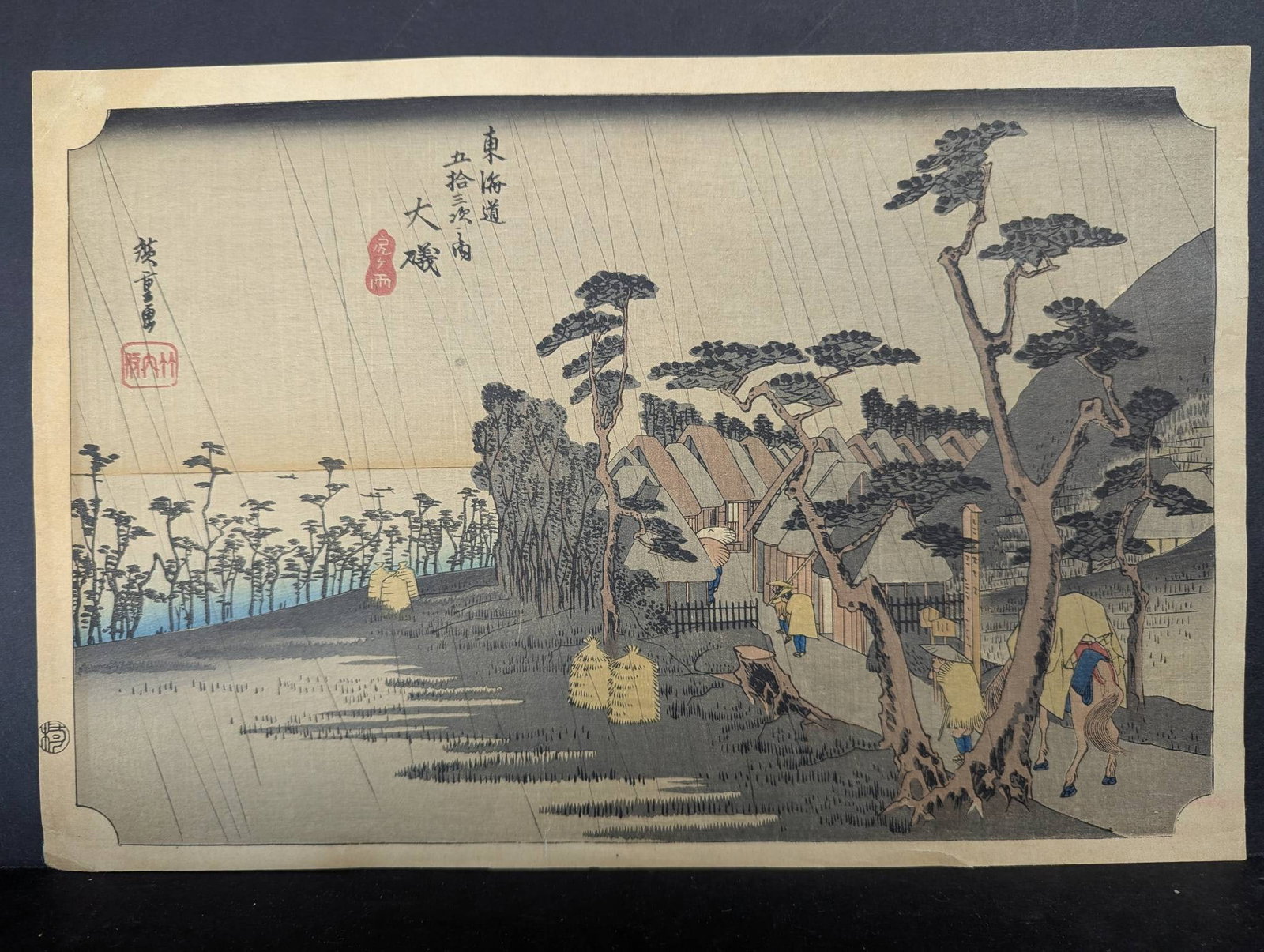 Japanese Woodblock Print by Utagawa Hiroshige Depicting Oiso Toraâ€™s Rain: Renowned Japanese woodblock print titled Oiso Toras Rain (Oiso Tora ga ame) by Utagawa Hiroshige. This is a reproduction of the original print, which is part of Hiroshiges famous series, The Fifty-thr
