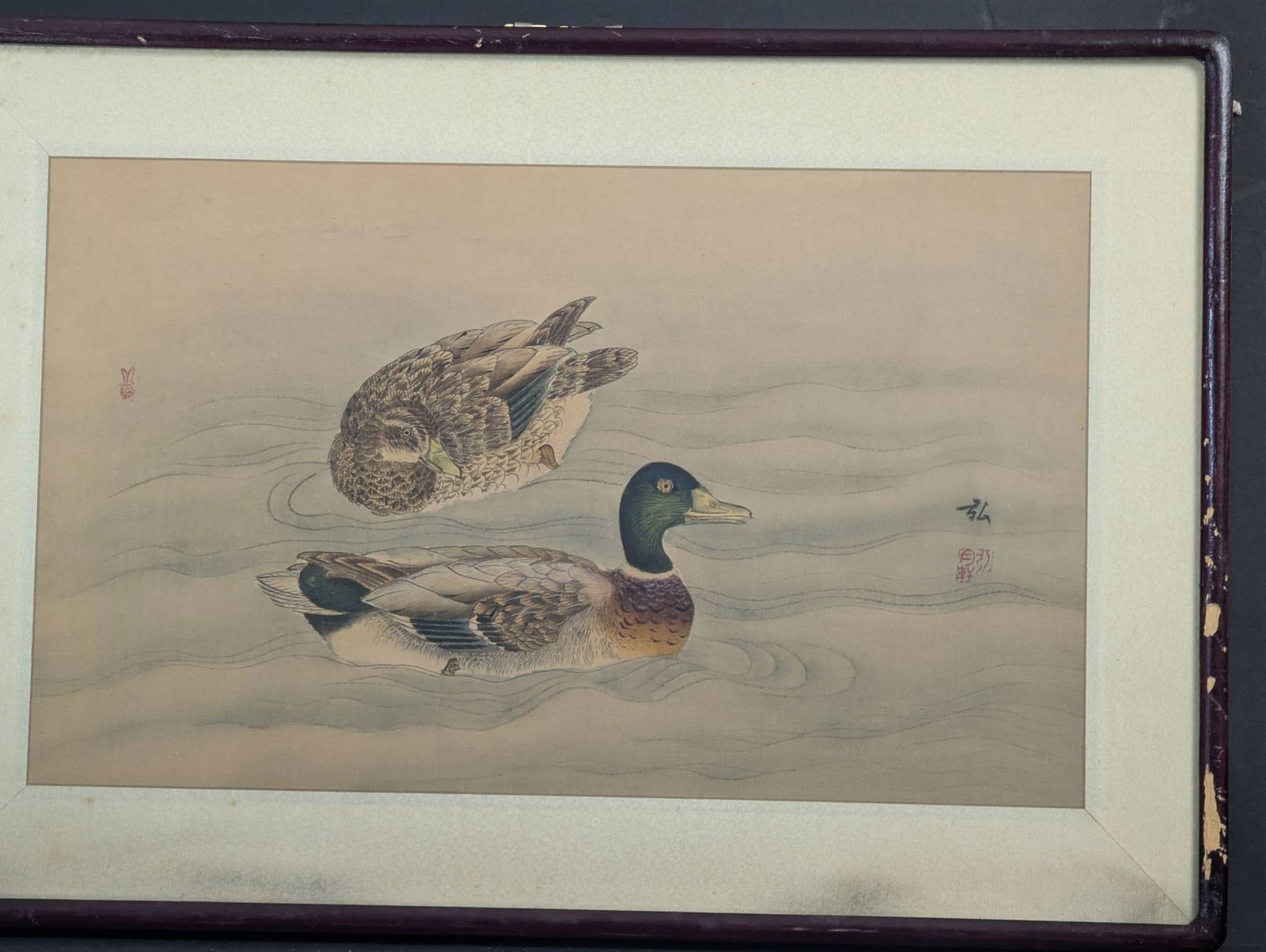 Japanese Painting on Silk Depicting Two Ducks on Water: A Japanese painting on silk measuring 23 inches high by 16 inches wide, with an image size of 18 inches high by 11 inches wide. The artwork portrays two ducks gracefully swimming in calm waters, showc
