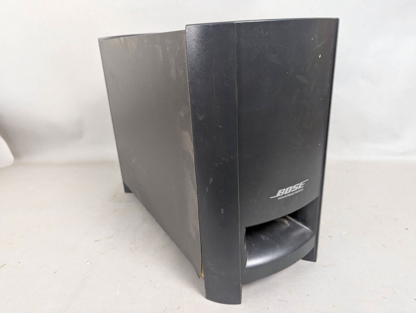 Bose PS3-2-1 Powered Speaker System Subwoofer Module: Bose PS3-2-1 powered speaker system subwoofer module measuring 19 inches high, 14 inches wide, and 9 inches deep. Unit is missing the power chord and has not been tested. The exterior case shows some