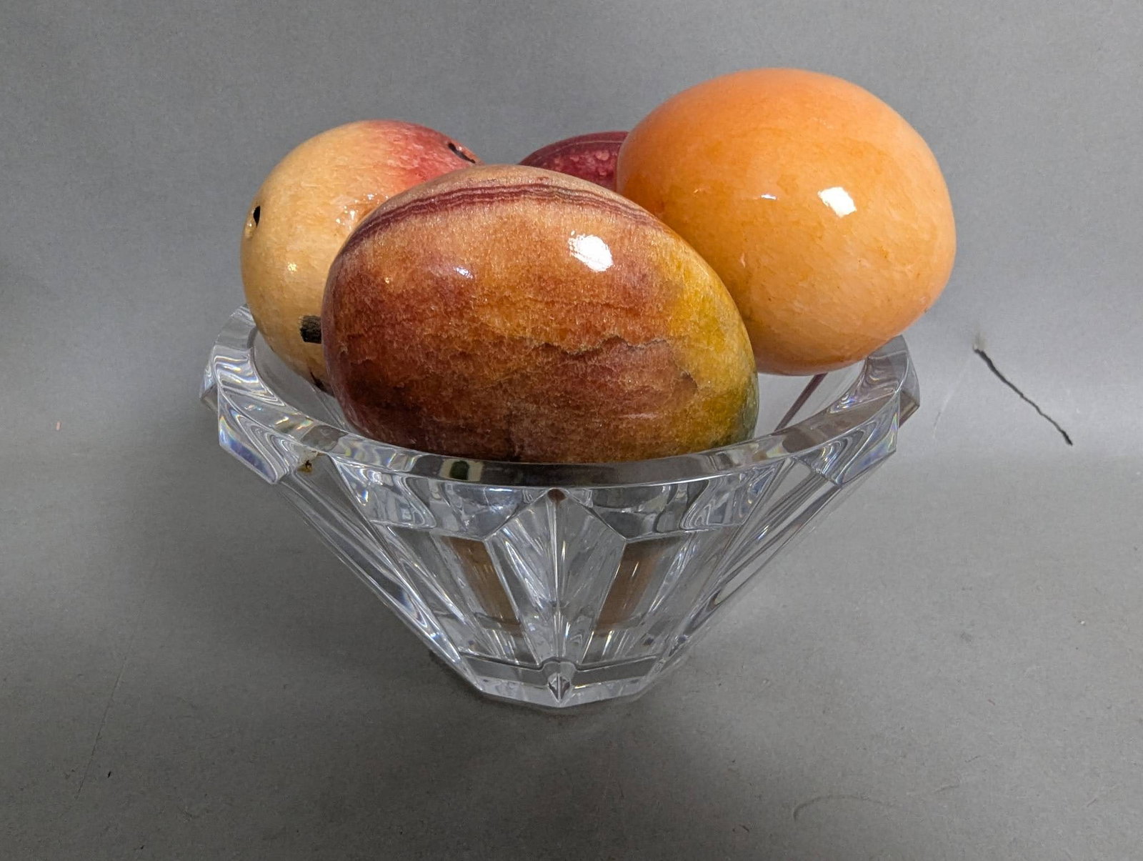 Baccarat Crystal Bowl with Glass Fruit: Baccarat crystal bowl measuring 4 inches high and 6 1/2 inches in diameter, accompanied by a set of 5 decorative glass fruits. The bowl features Baccarat's signature clear and faceted design, showcasi