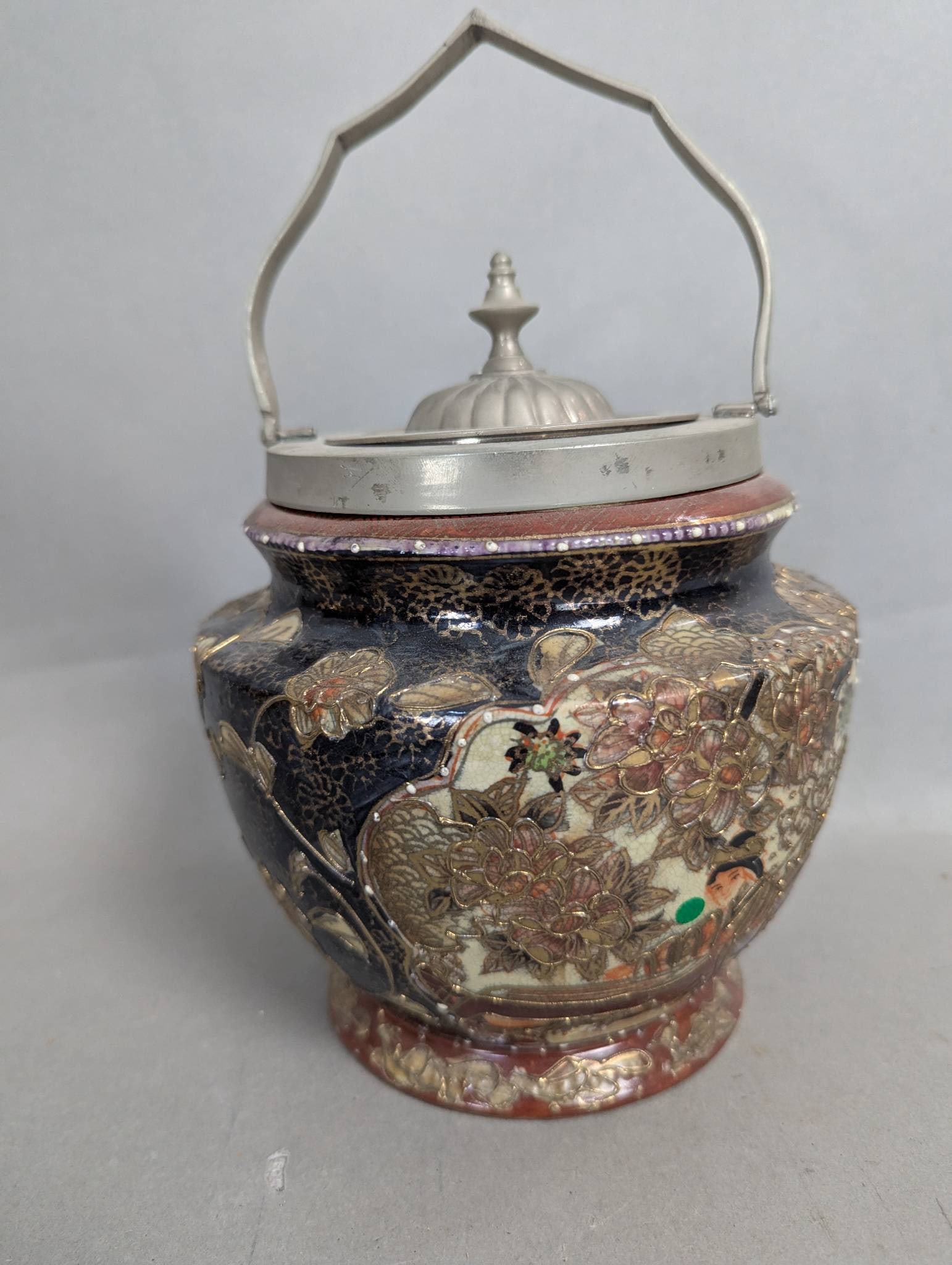 Japanese Satsuma-Style Biscuit Jar with Moriage and Gilt Accents: Antique or vintage Japanese Satsuma-style biscuit jar or barrel, measuring 7 high x 7 diameter. This earthenware pottery piece features the distinctive creamy beige crackled glaze that is characterist