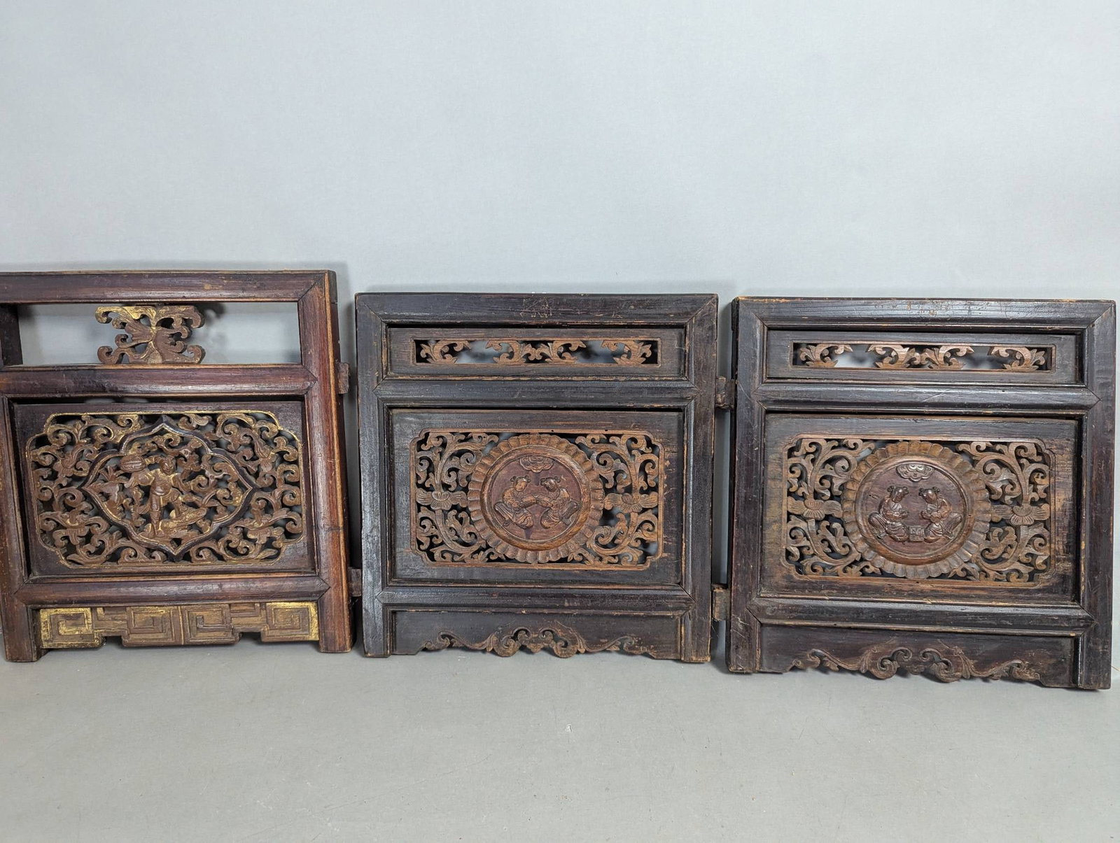 3 Chinese Wood Lattice Panels Taken From a Bed: Three Chinese wood lattice panels, originally removed from a bed. Each panel measures 17 inches high, 15 inches wide, and 1 1/2 inches deep. The pieces feature intricate carved designs, with two panel