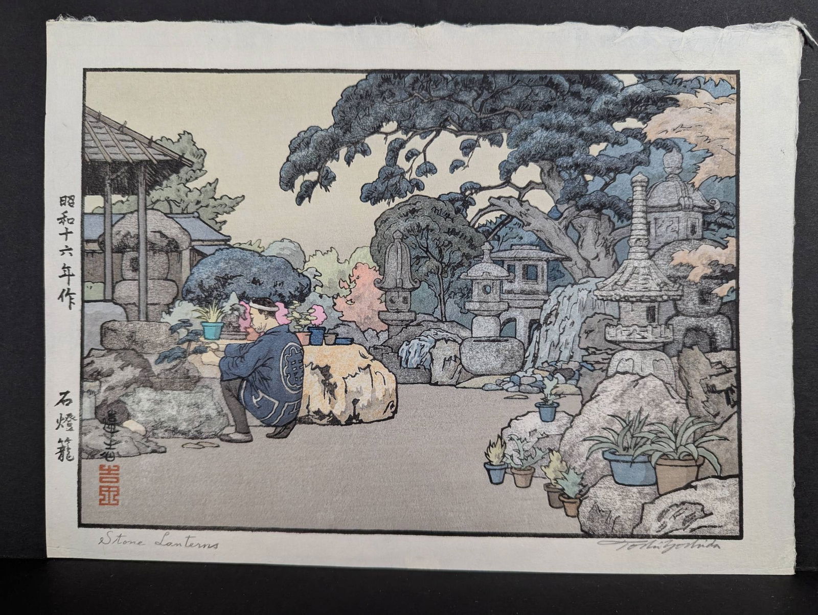 Japanese Woodblock Print by Toshi Yoshida â€“ Stone Lanterns, 1941: Woodblock print by Japanese artist Toshi Yoshida (1911-1995) titled Stone Lanterns and originally from 1941. This refined composition depicts a serene garden scene with a man tending potted plants ami