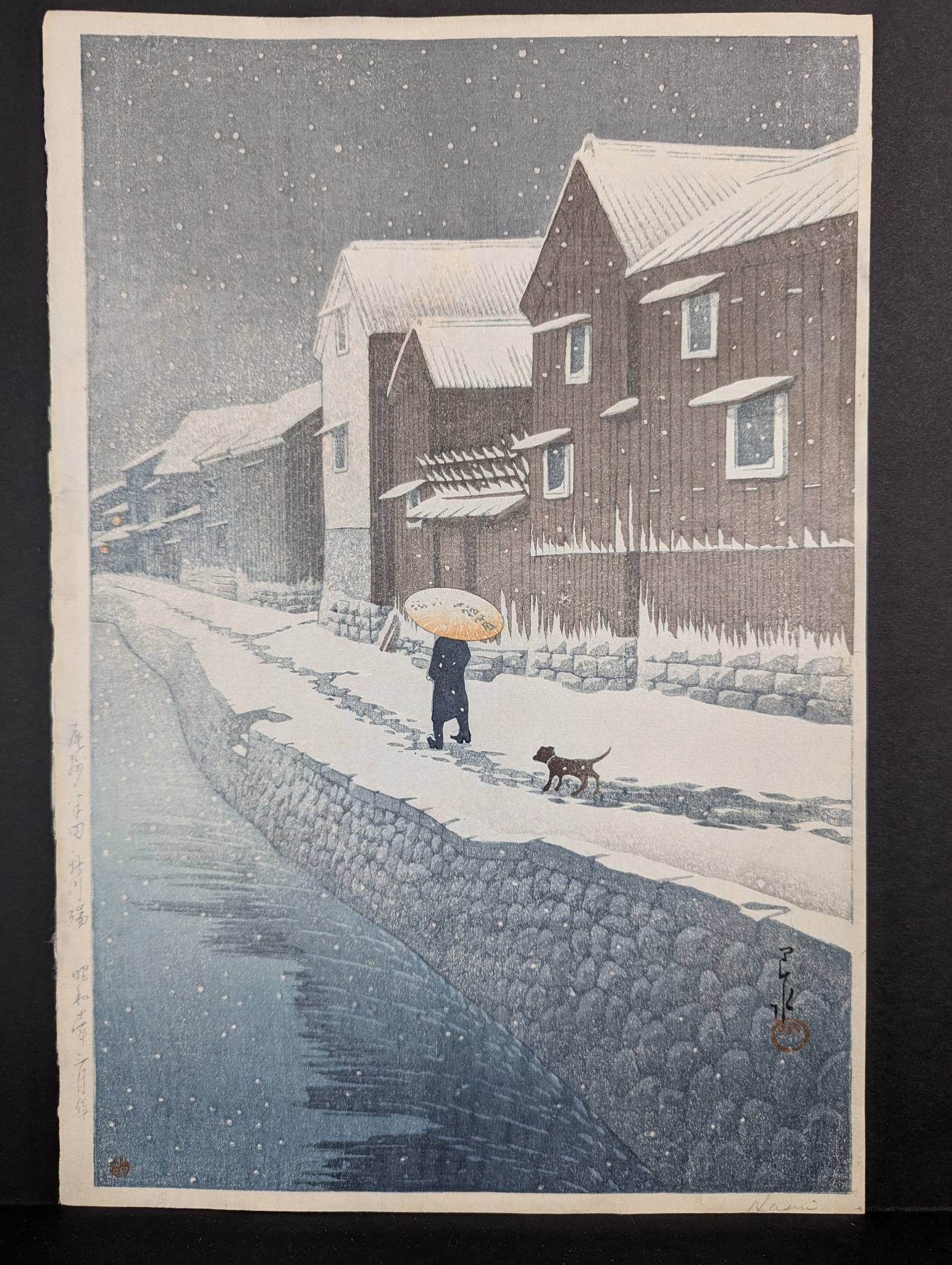 Japanese Woodblock Print by Kawase Hasui Depicting Riverside LandscapeÂ : Japanese woodblock print by Kawase Hasui (1883-1957) titled Shinkawa Riverside, Handa, from the Selection of Views of the Tokaido series, originally from 1935. This composition presents a tranquil sno