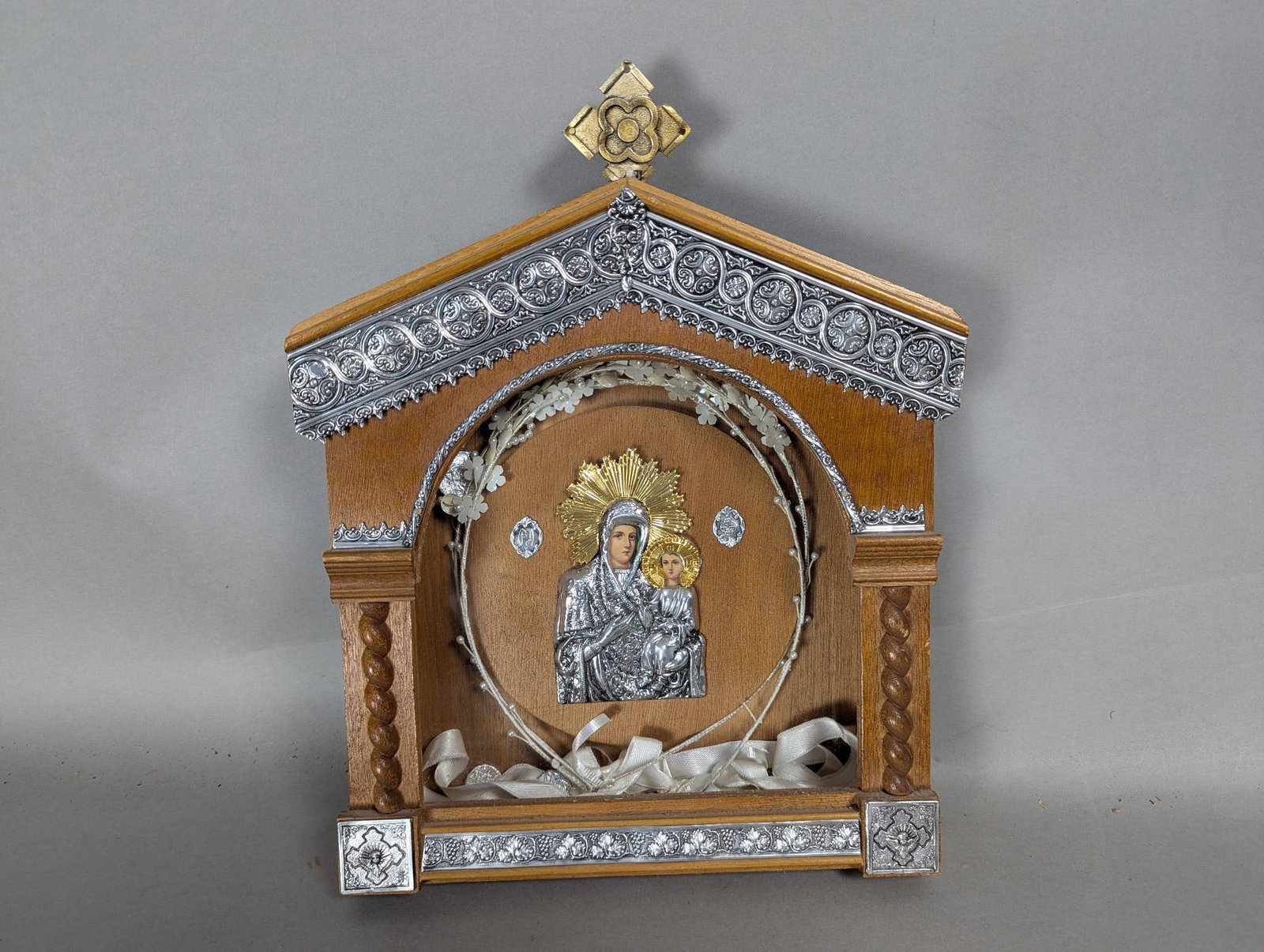 Orthodox Icon Depicting Virgin Mary and Christ Child in Wooden Frame: Orthodox icon featuring a depiction of the Virgin Mary and Child Jesus Christ within a wooden frame. The artwork represents traditional themes of divine and human nature, portraying Mary presenting Ch