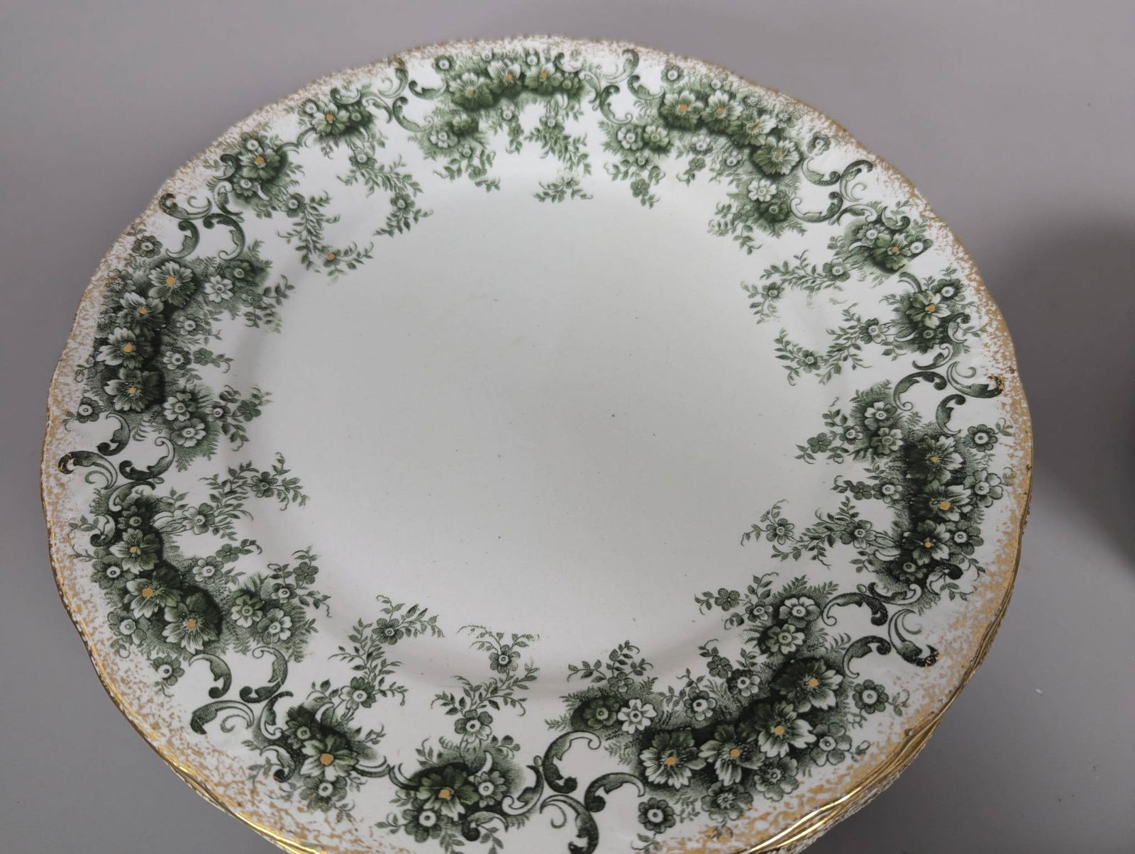 English Brooklyn Pattern Ceramic Dinnerware Set with 42 Pieces: Brooklyn pattern ceramic dinnerware set made in England. Comprises 42 pieces including dinner plates, saucers, cups, and a platter. The platter measures 12 inches wide by 9 inches deep. Notable condit