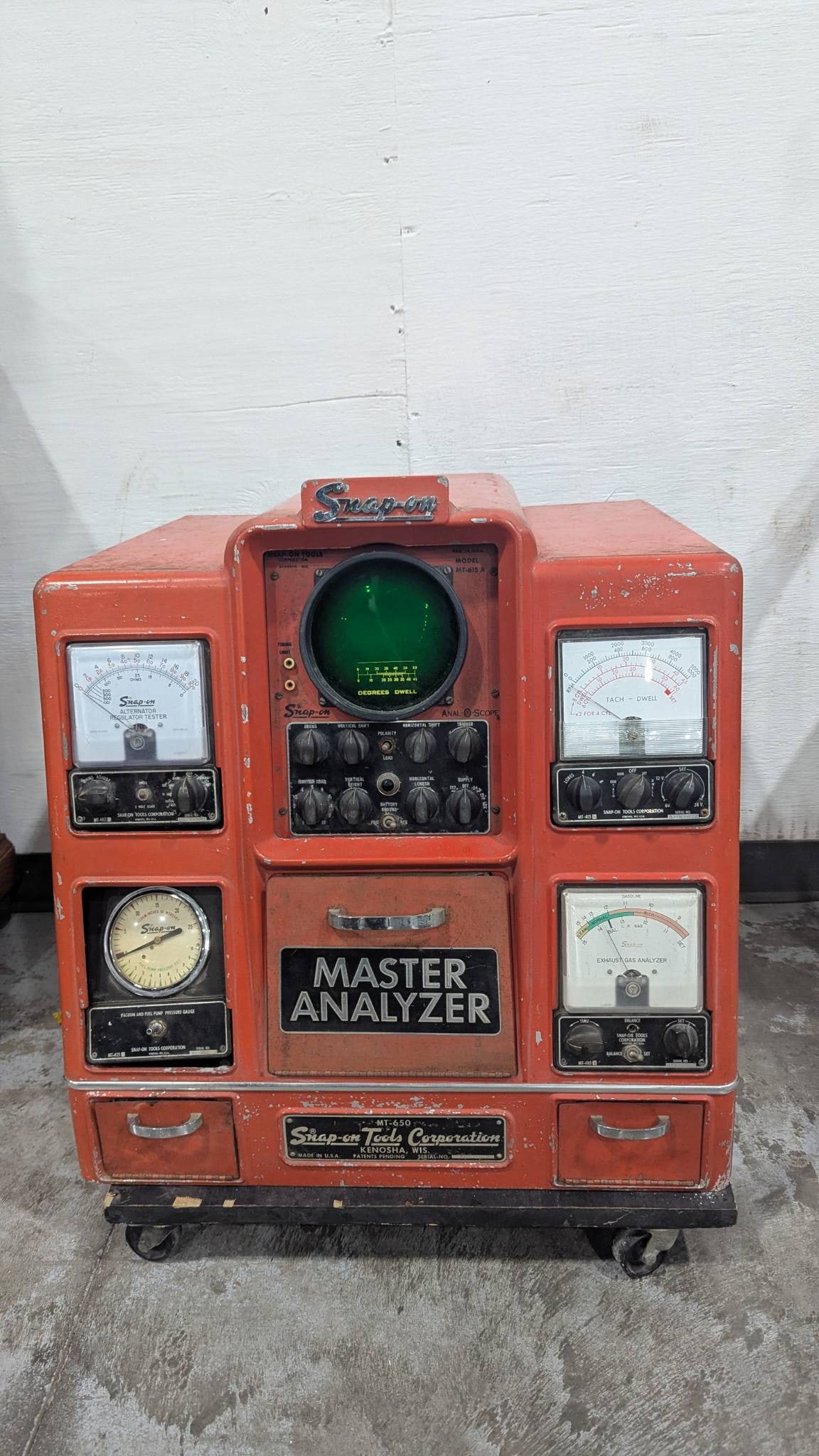 Snap On Master Analyzer by Sun Equipment Corporation: Snap On Master Analyzer manufactured by Sun Equipment Corporation. Housed in a red cabinet with various dials, gauges, and knobs, the device measures 25 inches high, 25 inches wide, and 20 inches deep