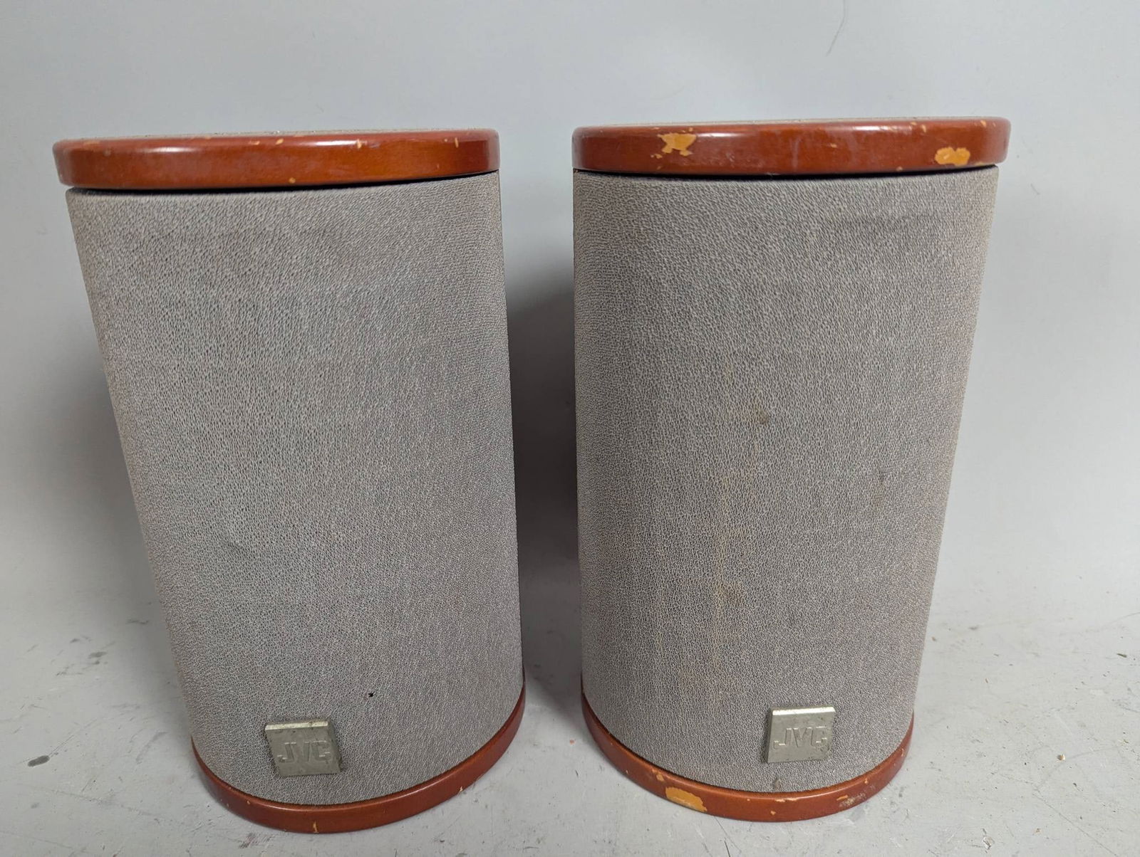JVC SP-FSSD9 Magnetically Shielded Speaker System: JVC SP-FSSD9 speakers with magnetically shielded design. Constructed with wood casing and grey fabric grilles. Each measures approximately 9 inches high, 5 1/4 inches wide, and 5 1/4 inches deep. Feat