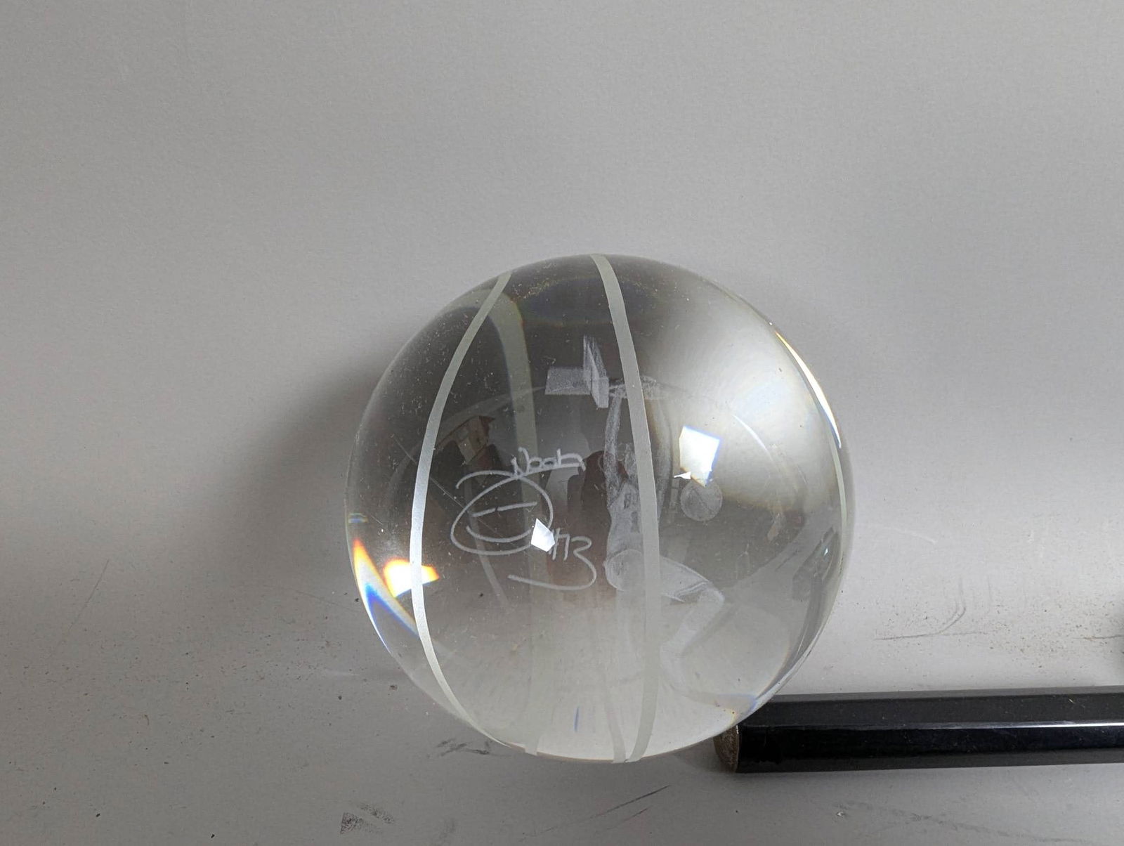 Crystal Basketball Paperweight with Etched Holographic Image Joakim Noah Chicago Bulls Player: Crystal paperweight featuring an etched holographic image of Joakim Noah, a former Chicago Bulls player. The clear spherical design incorporates white lines resembling a basketball. Measures 5 inches