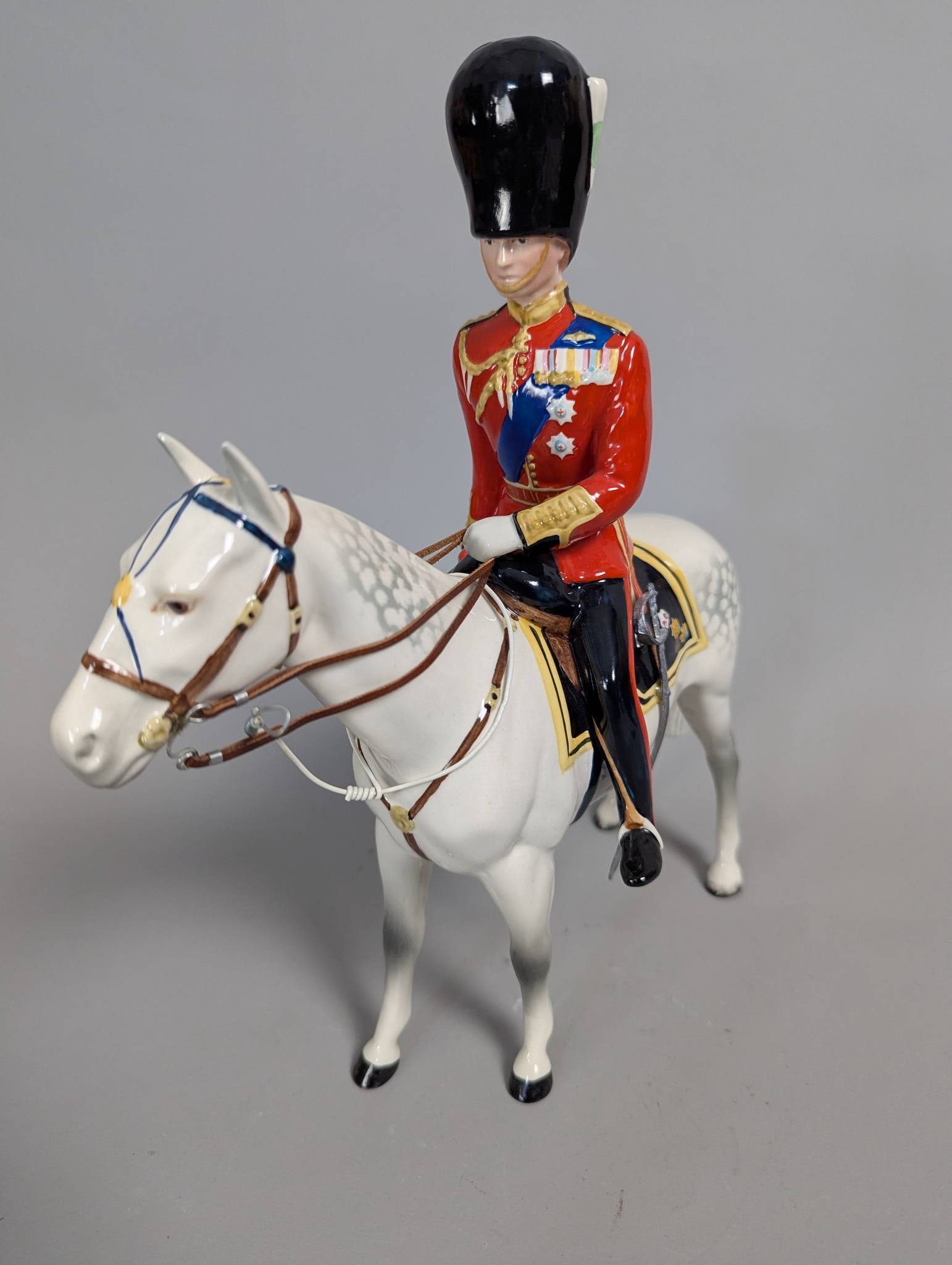 Beswick Duke of Edinburgh on Alamein Ceramic Figurine by Mr Folkard: Beswick ceramic figurine depicting H.R.H. Duke of Edinburgh mounted on his horse Alamein during the 1957 Trooping the Colour ceremony. Designed by Mr. Folkard and produced by the British pottery compa