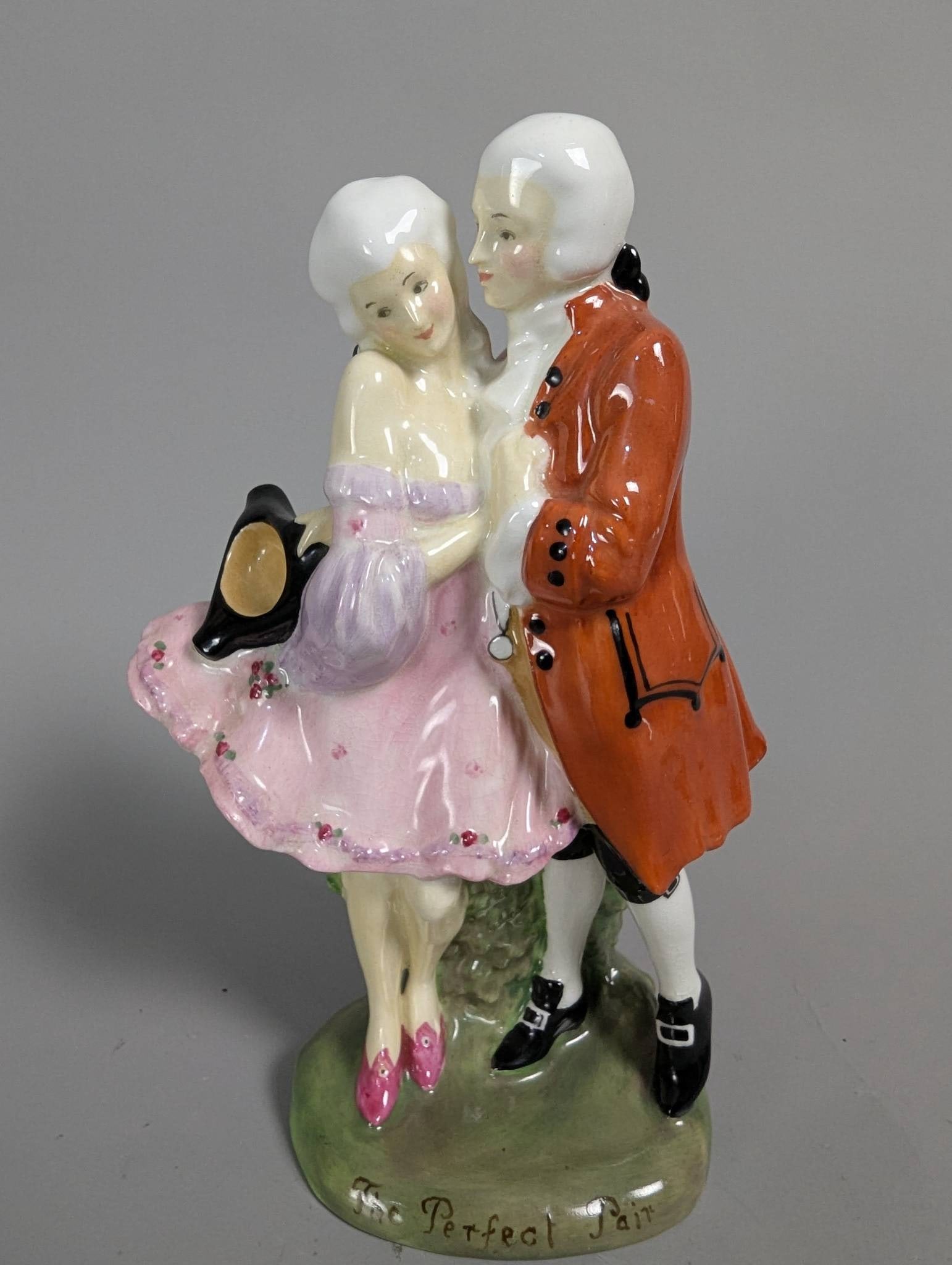 Royal Doulton Figurine HN 581 Depicting The Perfect Pair: Royal Doulton figurine titled The Perfect Pair, marked HN 581. Crafted in fine porcelain and hand-painted to depict a couple in 18th-century attire. The base features the Royal Doulton mark, along wit