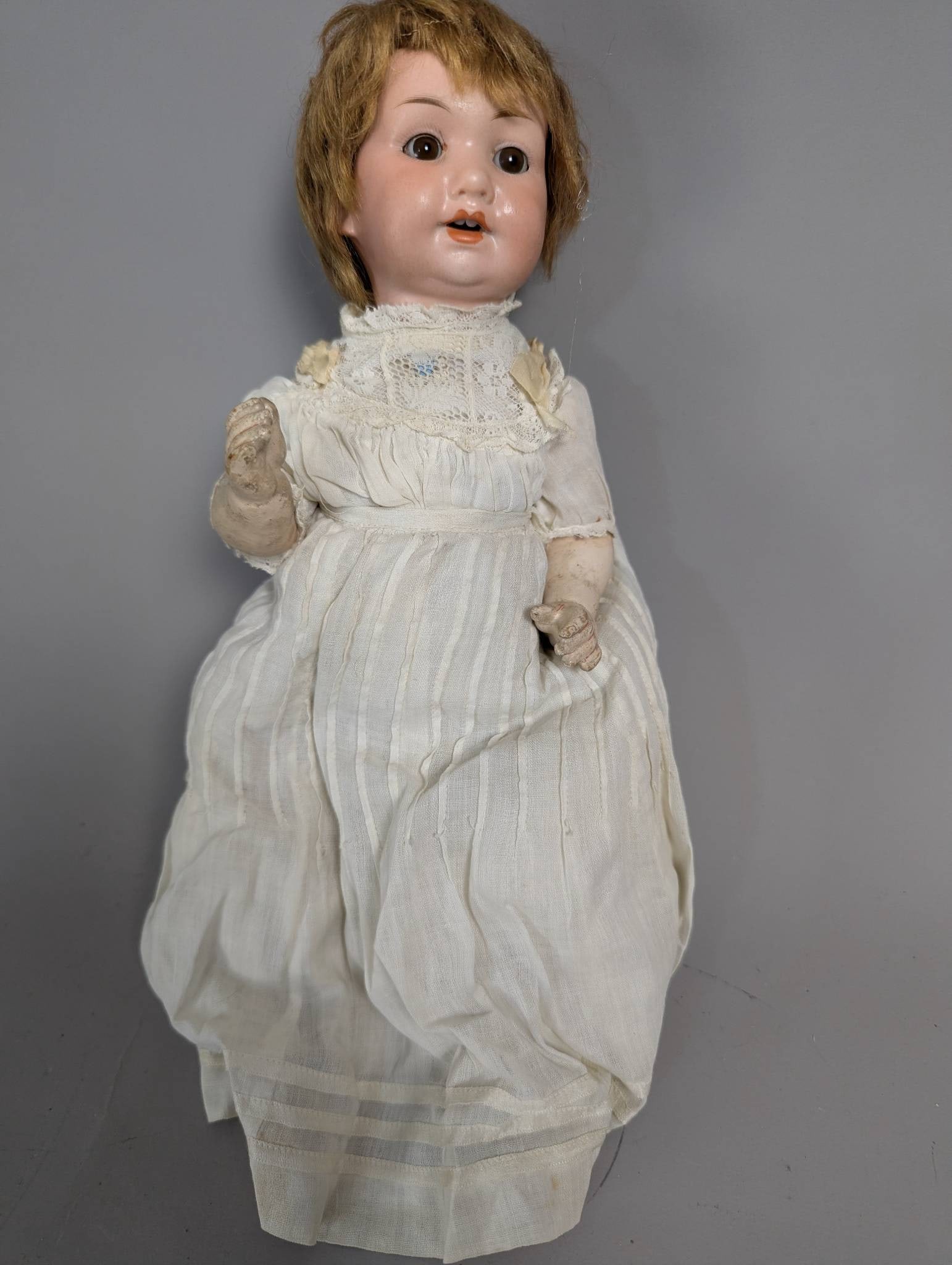 Armand Marseille Composition Doll from Germany with Lace Dress: Armand Marseille composition doll, made in Germany, standing 12 high. The doll features a bisque head with open mouth and molded teeth, marked on the back of the head with Armand Marseille markings. I