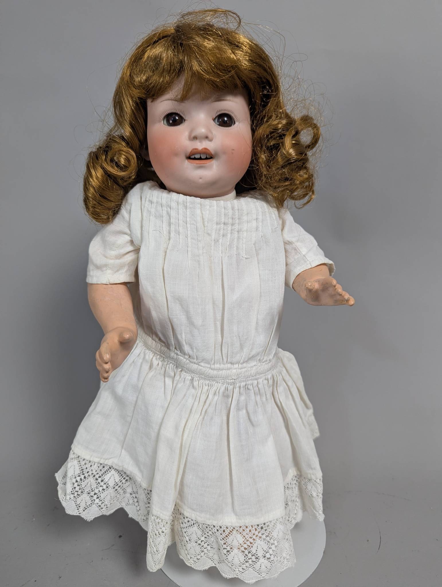 Heubach Koppelsdorf Thuringia 300 0 Bisque Head Doll with Brown Wig: Heubach Koppelsdorf doll with a bisque head, marked Heubach 300-0 Koppelsdorf Thuringia on the back. Standing 14 inches high, the doll features a finely detailed face with brown eyes, an open mouth sh