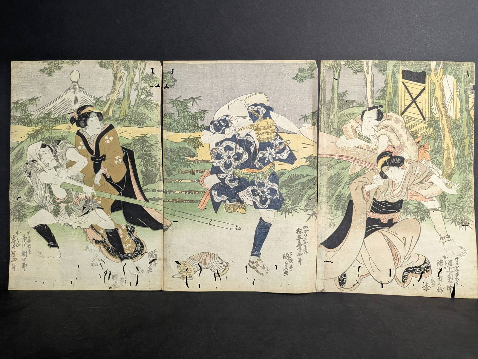 Original 19th Century Japanese Woodblock Print by Utagawa Kunisada Depicting Kabuki Play: Japanese woodblock triptych print by Utagawa Kunisada (1786-1865) depicting a scene from the Kabuki play Cho mo Hiyoku Yamazaki Odori. Dated to 1819, this print showcases intricate detail and vivid im