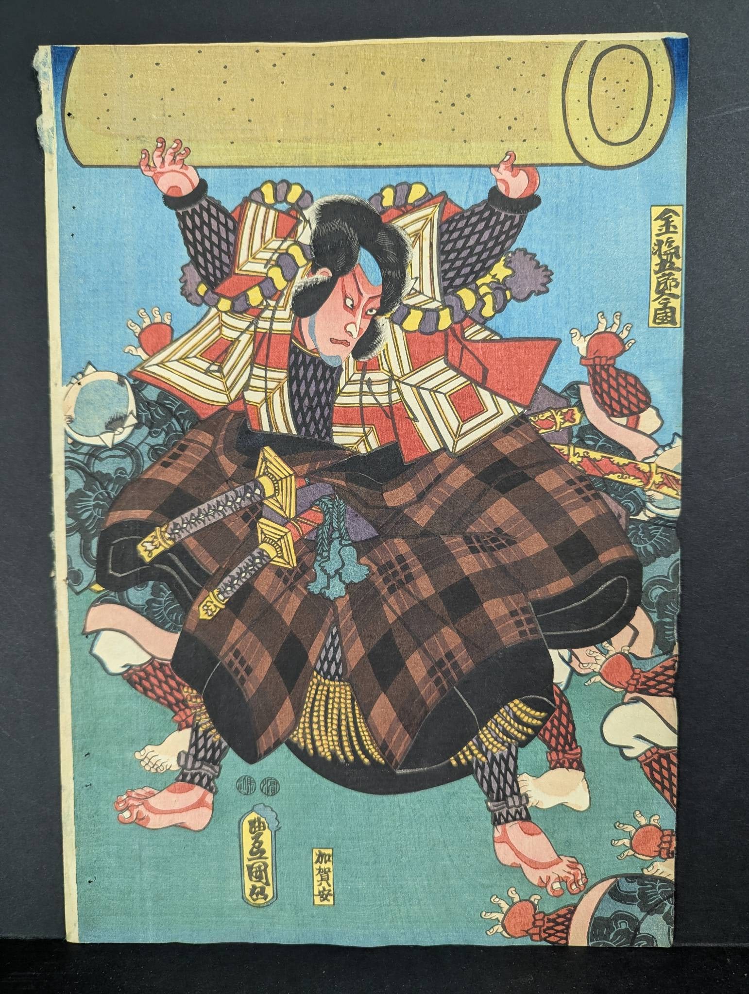 Japanese Woodblock Print of Samurai by Toyokuni III: Original 19th-century Japanese woodblock print attributed to Toyokuni III. The artwork depicts a vibrant samurai figure in traditional attire wielding dual swords, surrounded by dynamic details. Dimen