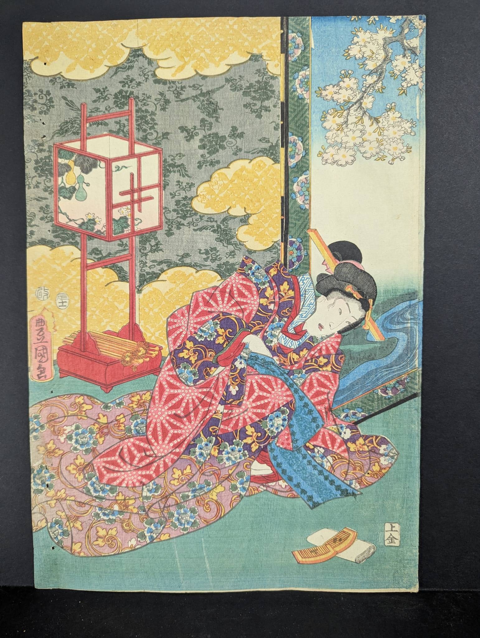 Japanese Woodblock Print by Toyokuni III Depicting a Woman in a Vibrant Kimono: Japanese woodblock print by Toyokuni III, also known as Utagawa Kunisada, who was a prominent ukiyo-e artist of the 19th century. This original work measures 9 3/4 high, 14 1/2 wide and features a bea