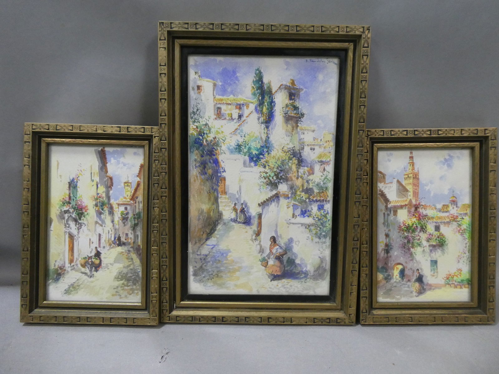 Set 3 Francisco Candela Views of Seville Watercolor Paintings: Francisco Candela (act. ca. 1890-1910) Three views of Seville in matching frames. All signed upper right (partially obscured but legible). All framed under glass Nice vivid colors and very much ready