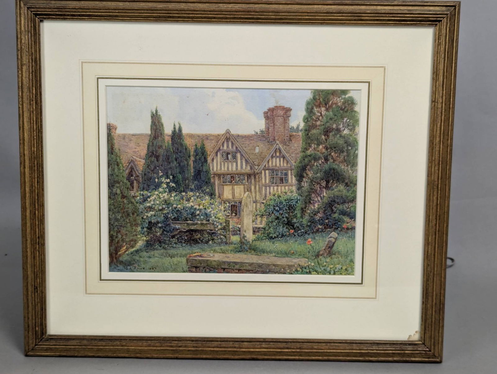 Watercolor of Godscacre by Ernest Arthur Rowe SignedÂ 1907: Watercolor painting by Ernest Arthur Rowe (1863-1922) titled Godscacre, depicting a charming English garden scene with a half-timbered house surrounded by lush vegetation. The piece is signed and date