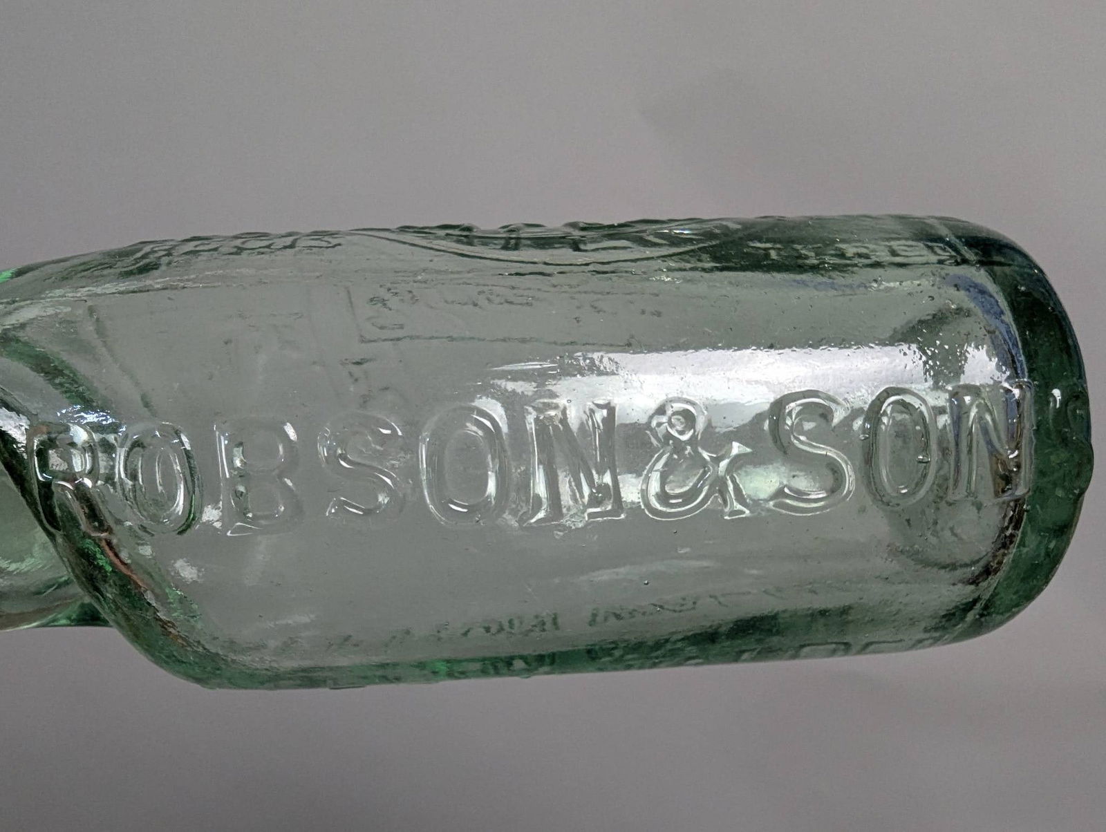 Vintage Robson and Son Glass Bottle with Embossed Lettering - 4