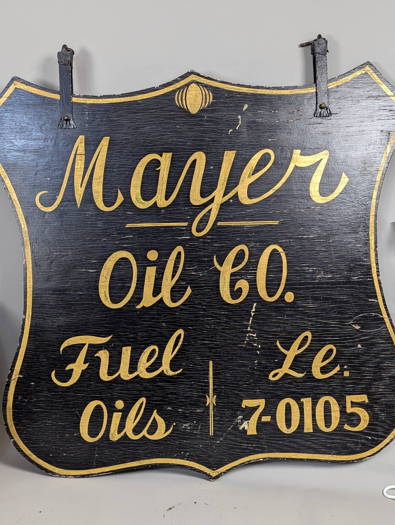 Antique Hand Painted Double Sided Mayer Oil Co Wood Sign: Antique hand painted wood sign featuring Mayer Oil Co text in gold lettering on a black background. Double sided with identical design on both sides. Measures 50 high x 48 across. Reflects normal wear
