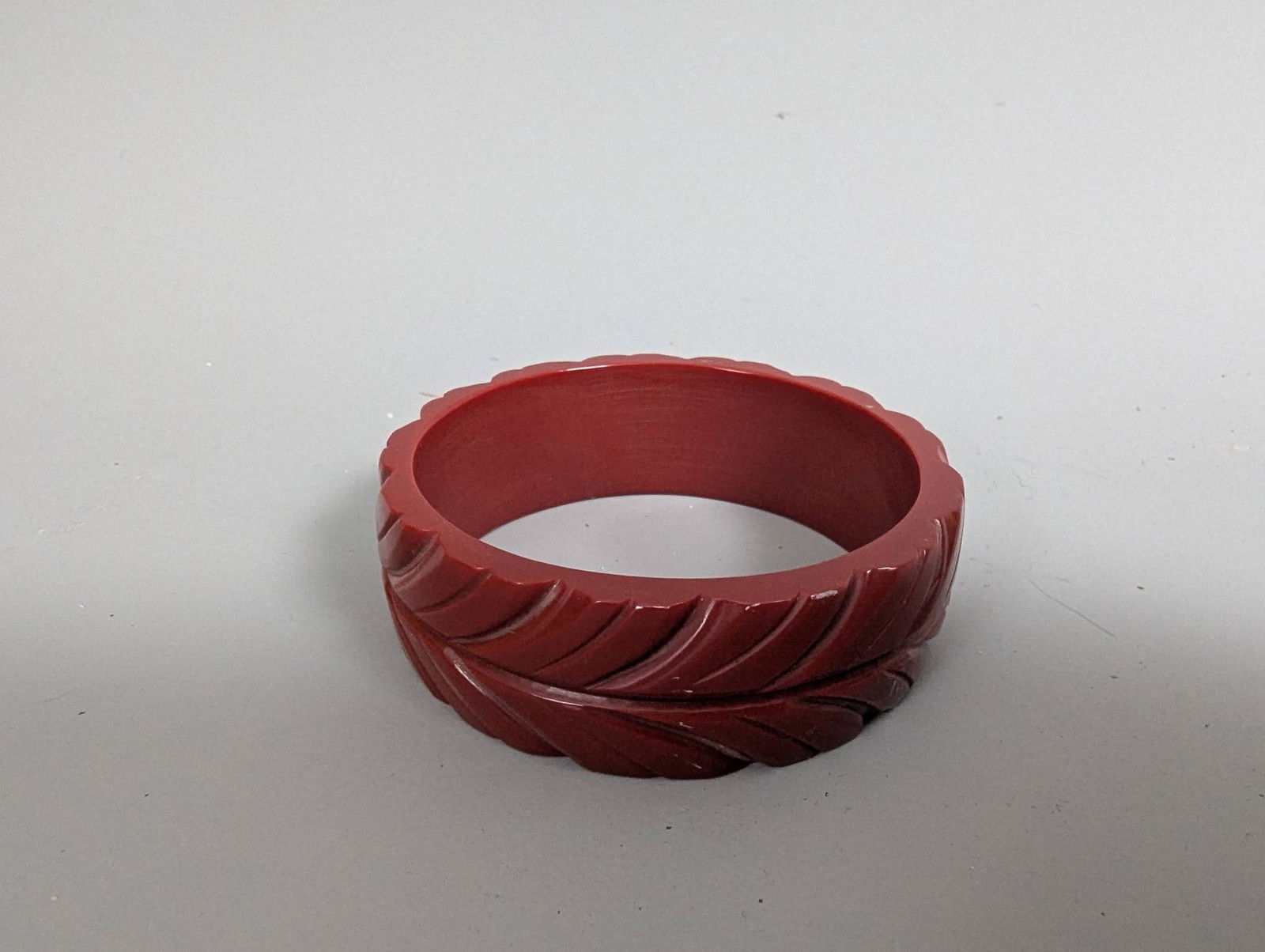 Art Deco Cherry Red Bakelite Bangle with Leaf Carvings (1 of 4)