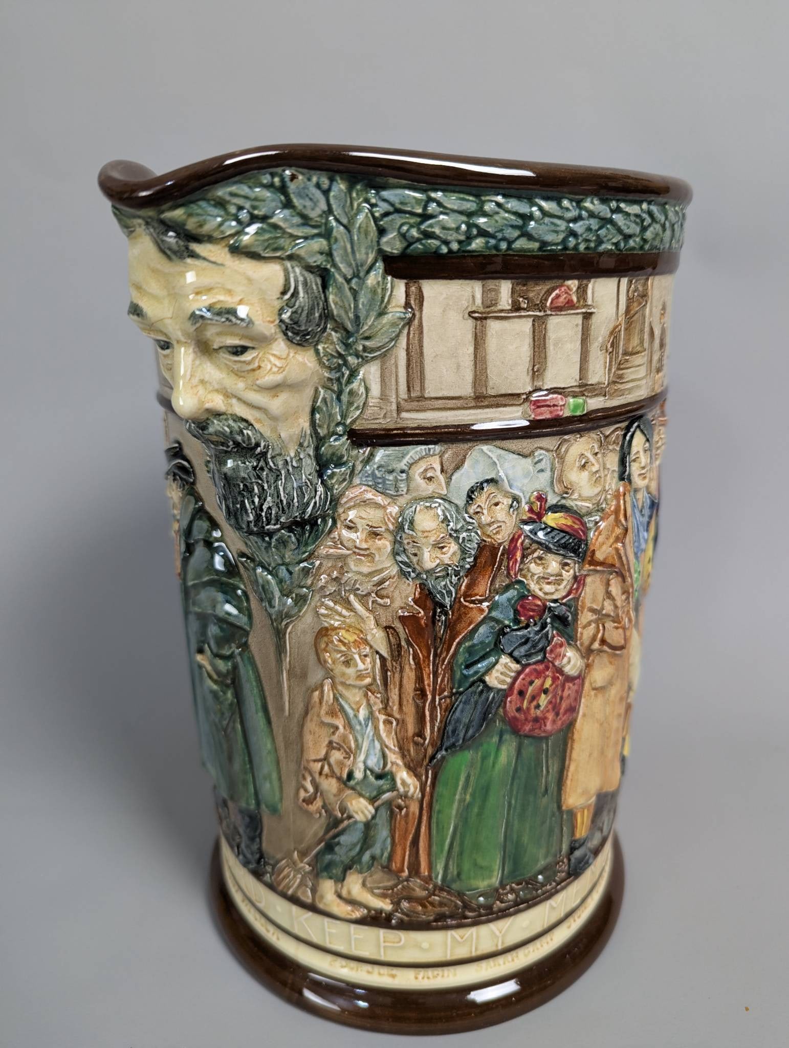 Royal Doulton Limited Edition Dickens Jug Designed by Charles Noke and Harry Fenton: Royal Doulton limited edition Dickens Jug, issued in 1936 as a part of a series by Charles Noke and Harry Fenton. This ceramic jug features relief decoration with a polychrome glaze, depicting Charles