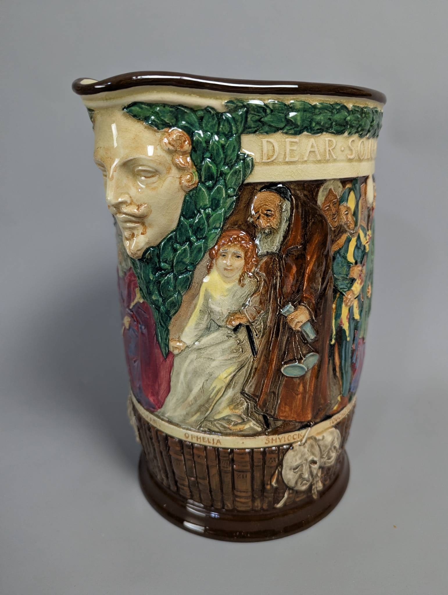 Royal Doulton Shakespeare Jug Designed by Charles Noke and Harry Fenton: Royal Doulton Shakespeare Jug from a limited edition of 1000, designed in 1933 by Charles Noke and Harry Fenton. The jug features vibrant and detailed character reliefs representing Shakespeare's icon