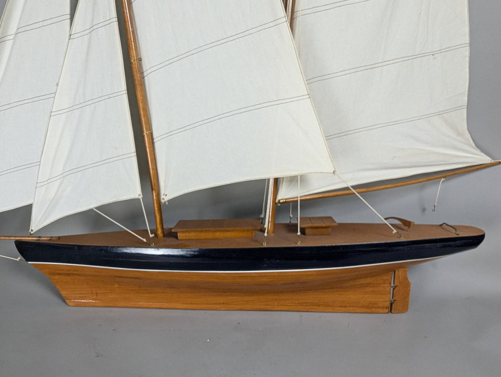 Model of a Two-Masted Schooner Yacht with Dark Blue Hull and White Cloth Sails - 10