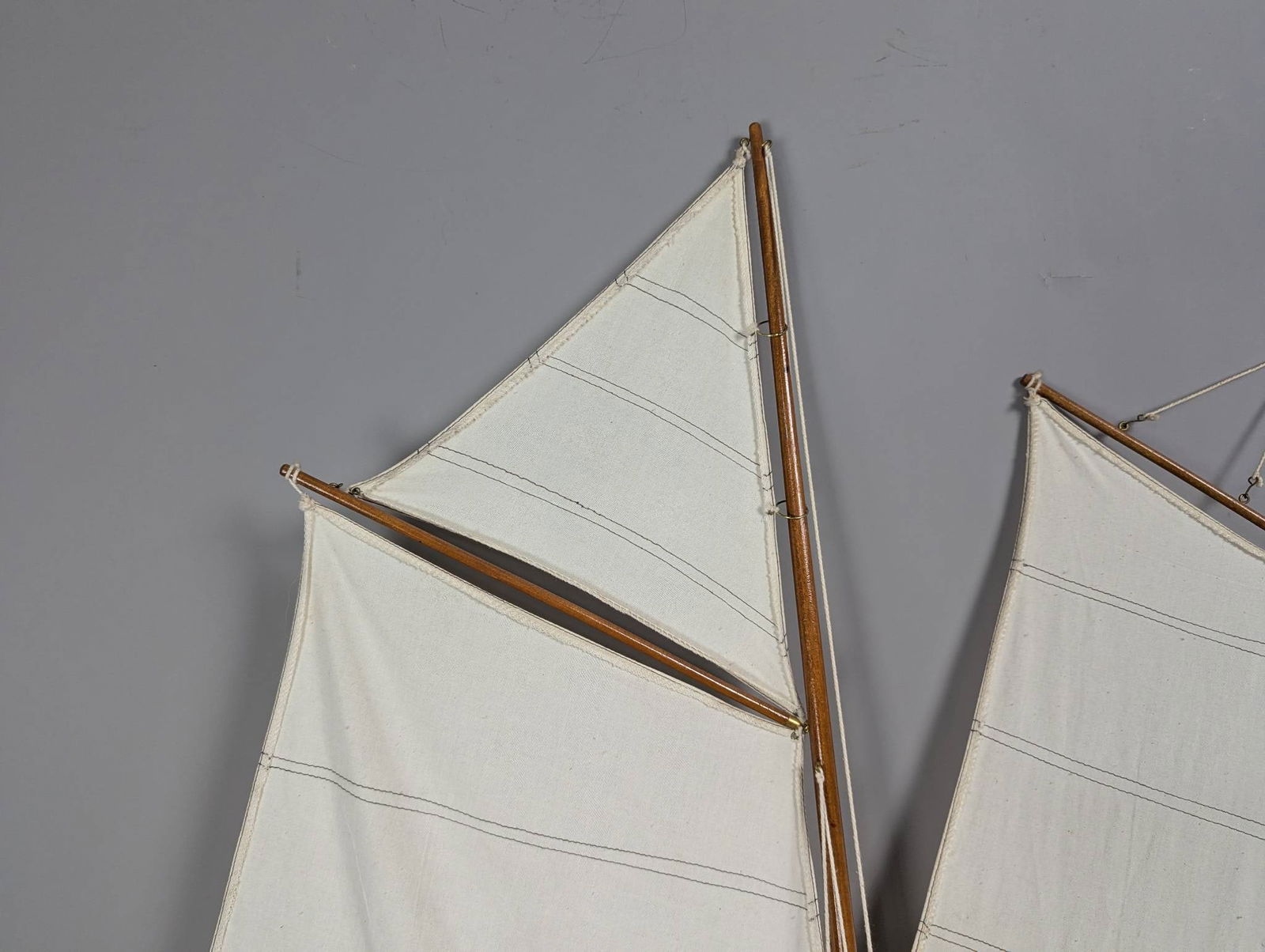 Model of a Two-Masted Schooner Yacht with Dark Blue Hull and White Cloth Sails - 2