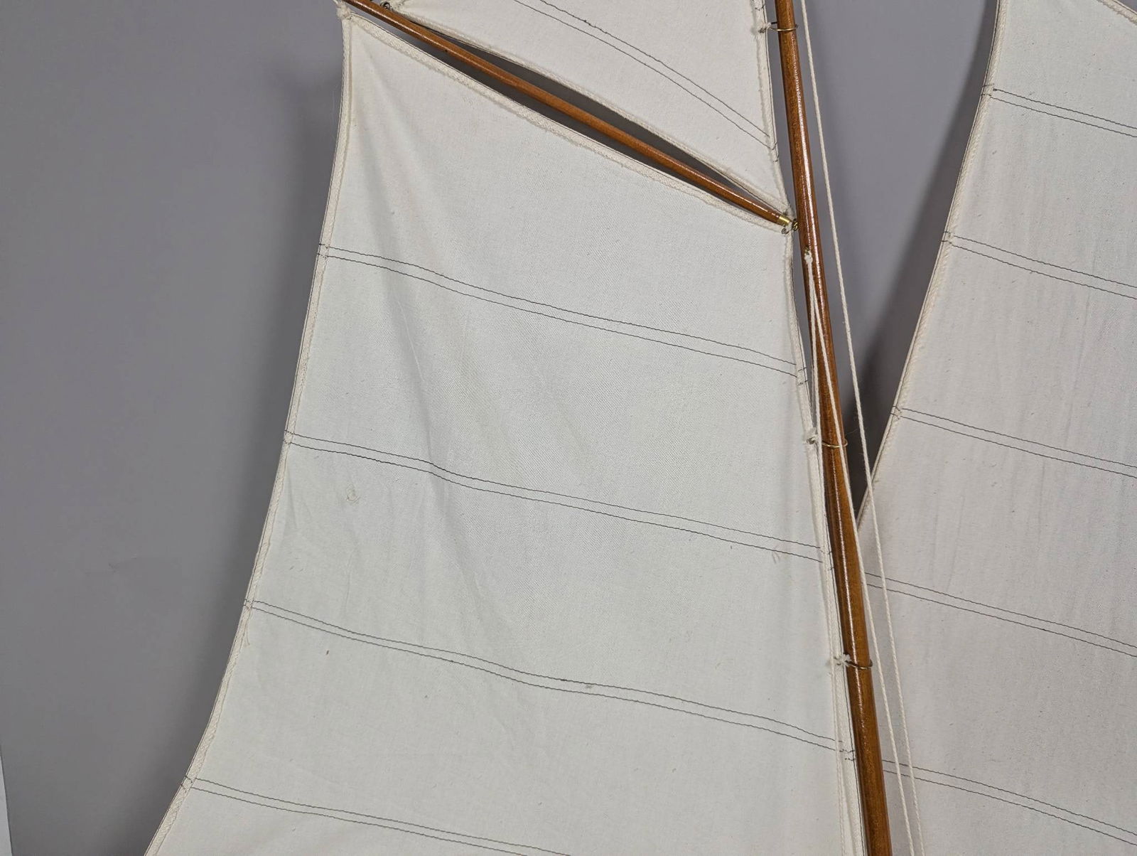 Model of a Two-Masted Schooner Yacht with Dark Blue Hull and White Cloth Sails - 3