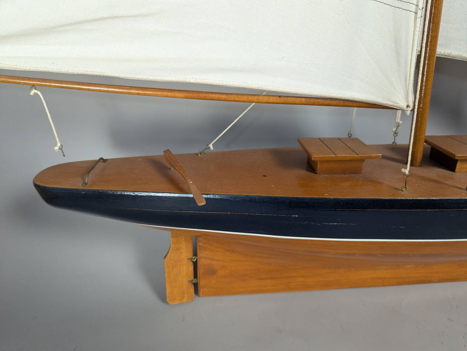 Model of a Two-Masted Schooner Yacht with Dark Blue Hull and White Cloth Sails - 5