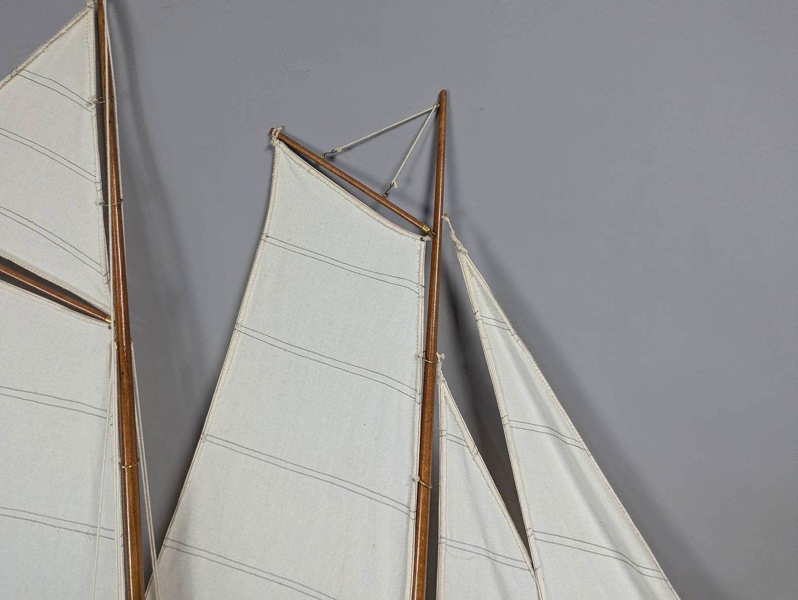 Model of a Two-Masted Schooner Yacht with Dark Blue Hull and White Cloth Sails - 6