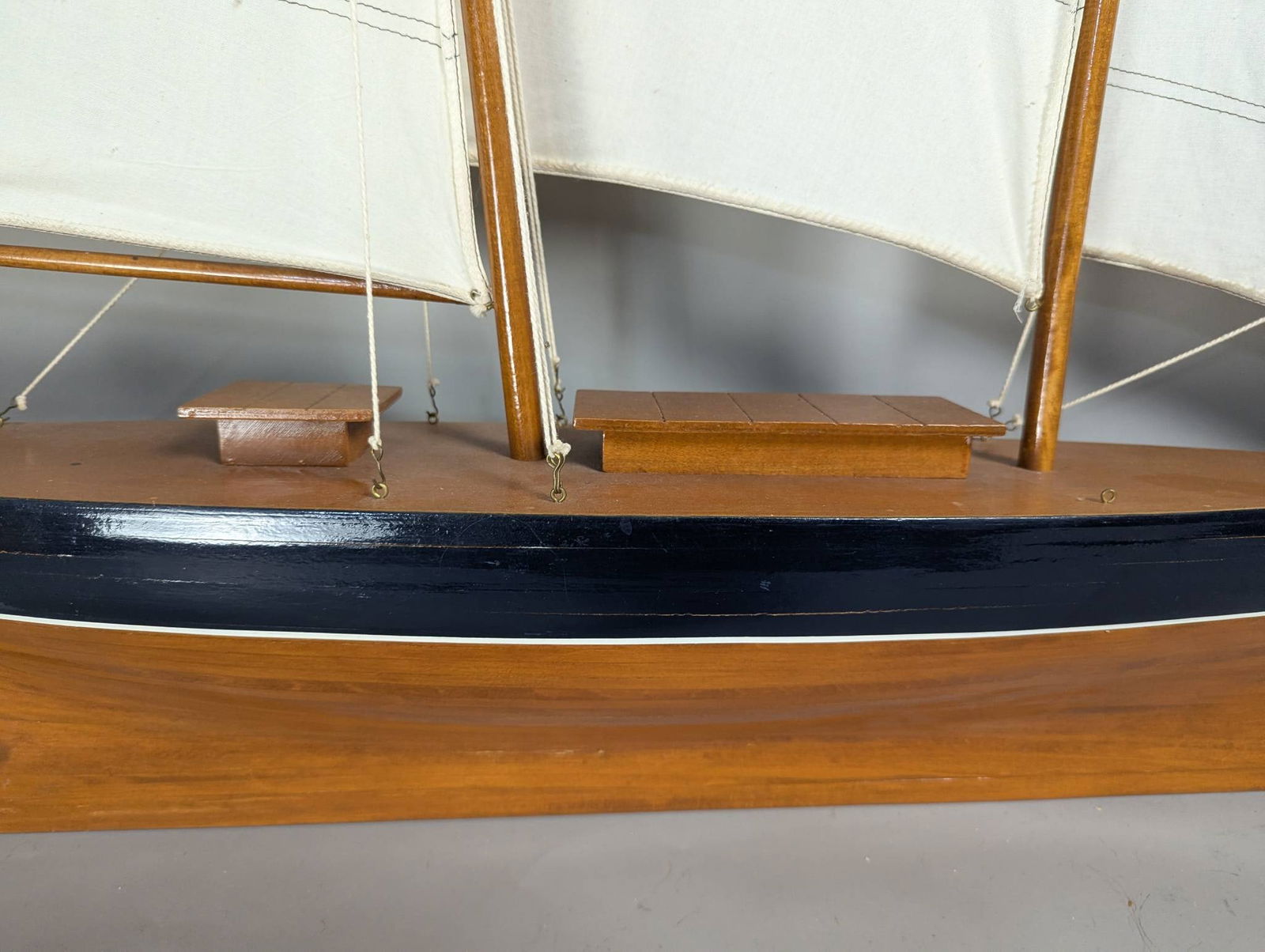 Model of a Two-Masted Schooner Yacht with Dark Blue Hull and White Cloth Sails - 7