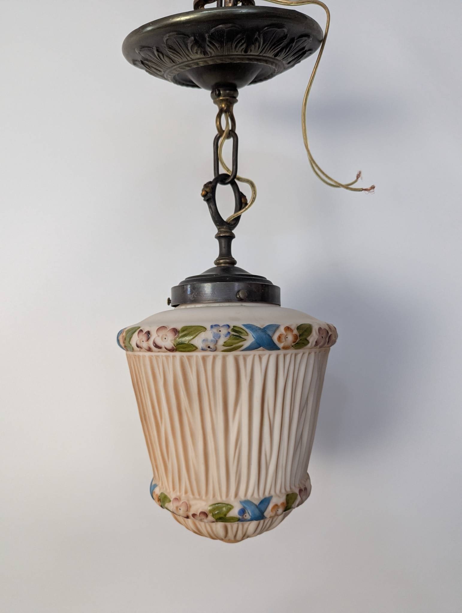 Art Nouveau Milk Glass Pendant Light with Hand-Painted Floral Design: Art Nouveau pendant light featuring a milk glass shade with a hand-painted floral design. The piece measures 18 high x 9 diameter and has been rewired and is ready to hang. The floral motif displays v