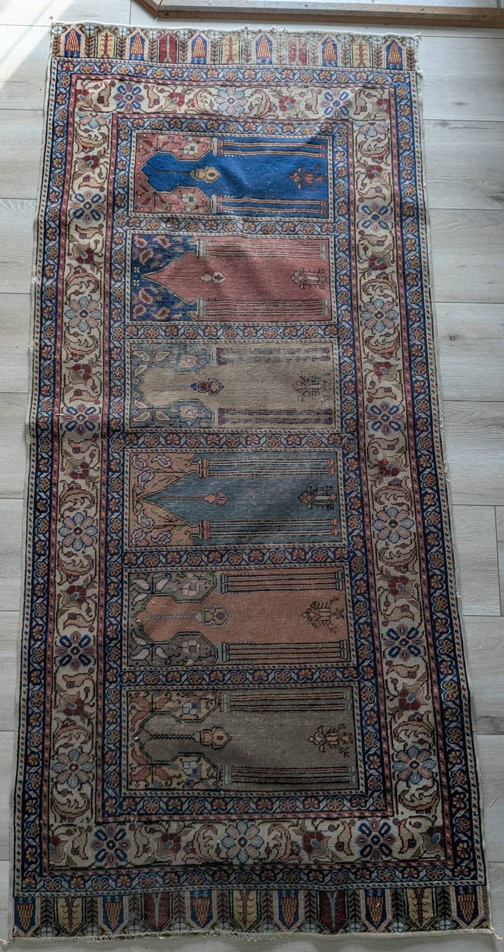 Turkish Kayseri Saf Runner Rug with Prayer Niche Design: A vintage or antique Turkish Kayseri Saf runner rug featuring a hand-knotted construction and a traditional Anatolian design with multiple prayer niches. This type of rug, known as a saff rug,