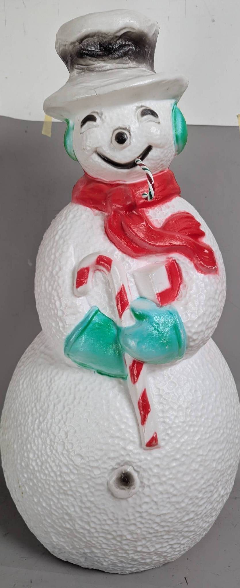 Union Products Dimpled Snowman Blow Mold Lighted Christmas Decoration: Vintage 40-inch Union Products dimpled snowman blow mold, a lighted Christmas decoration suitable for indoor and outdoor use. The snowman is crafted from white plastic with a textured, dimpled finish