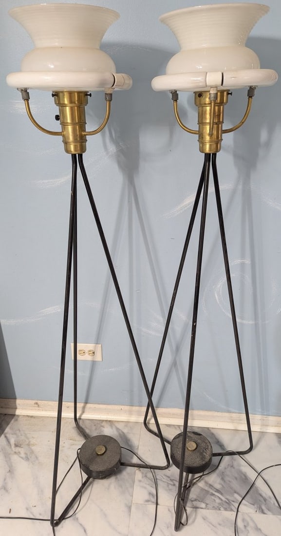 Mid Century Modern Pair of Gerald Thurston Tripod Floor Lamps: **Important** Please read below description on how to avoid high shipping costs. Illuminate your space with this stunning pair of Mid Century Modern tripod floor lamps designed by Gerald Thurston